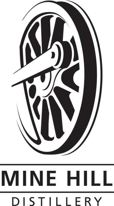 Logo for Mine Hill Distillery featuring a mill wheel