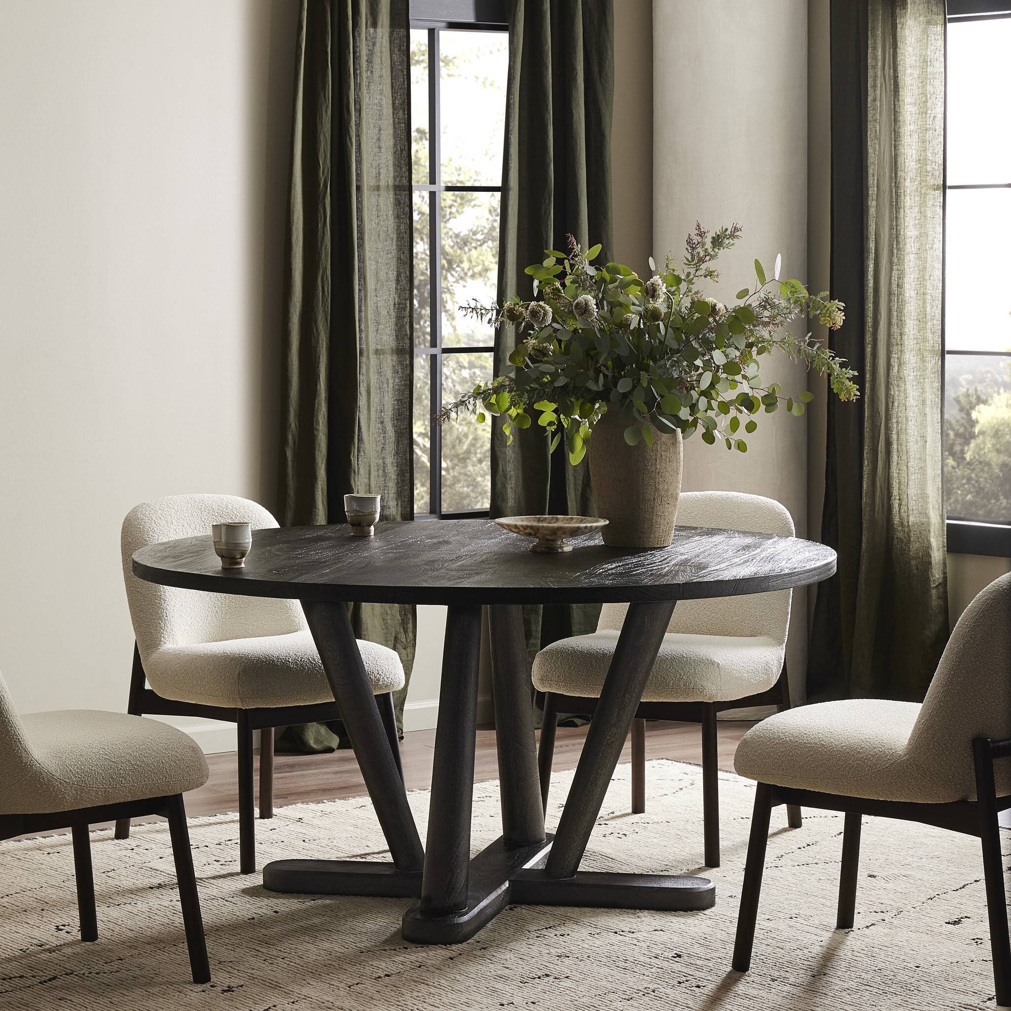 Elegant dining table and chairs set featuring a modern design and luxurious finish, perfect for sophisticated dining spaces.