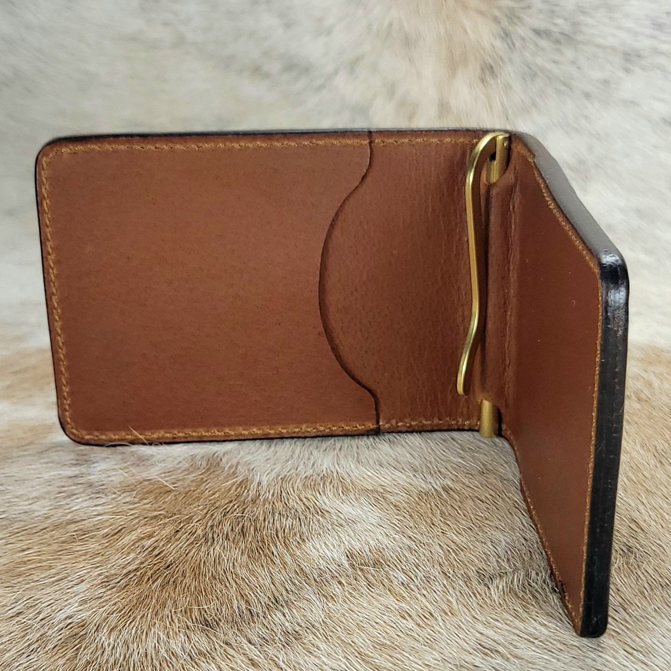 Solid brass premium money clip in a leather wallet.