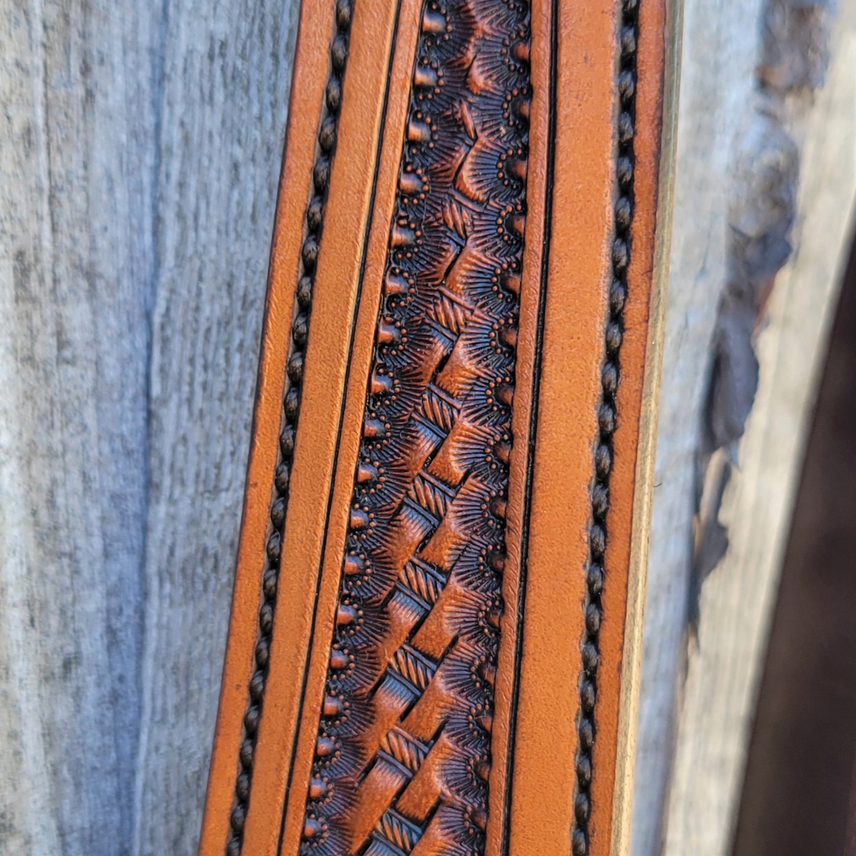 Hand tooled basket stamp on a western headstall
