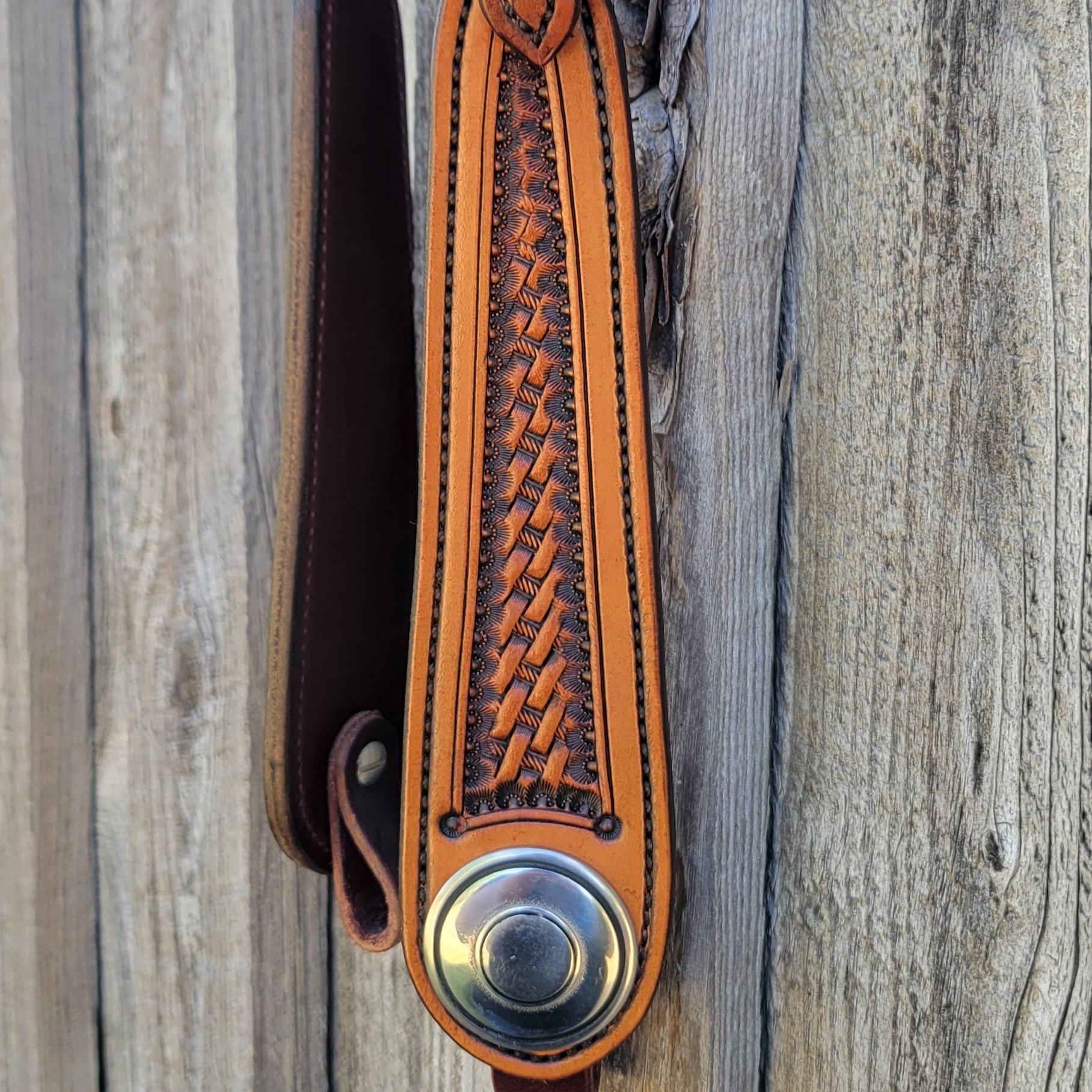 Stainless steel conchos and basket stamp tooling on a western headstall