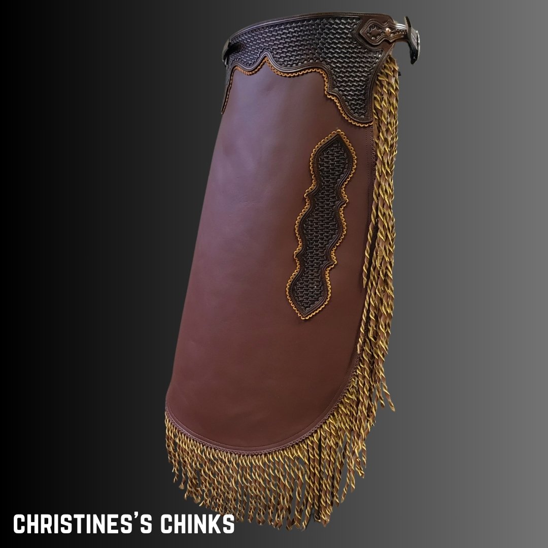 Christine's custom chinks included twisted fringe and basket stamp tooling.