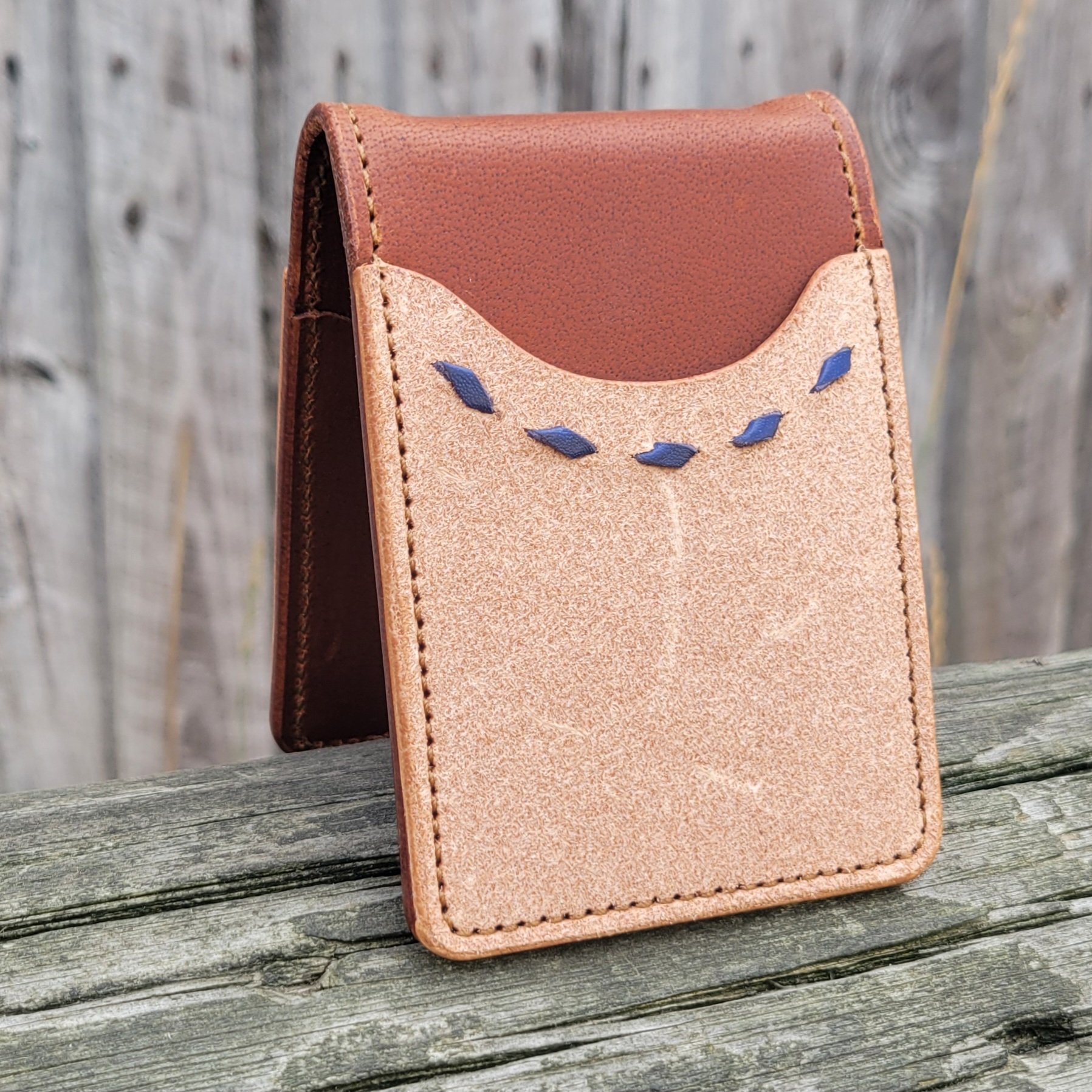 Western leather wallet with roughout leather and buckstitch accent.