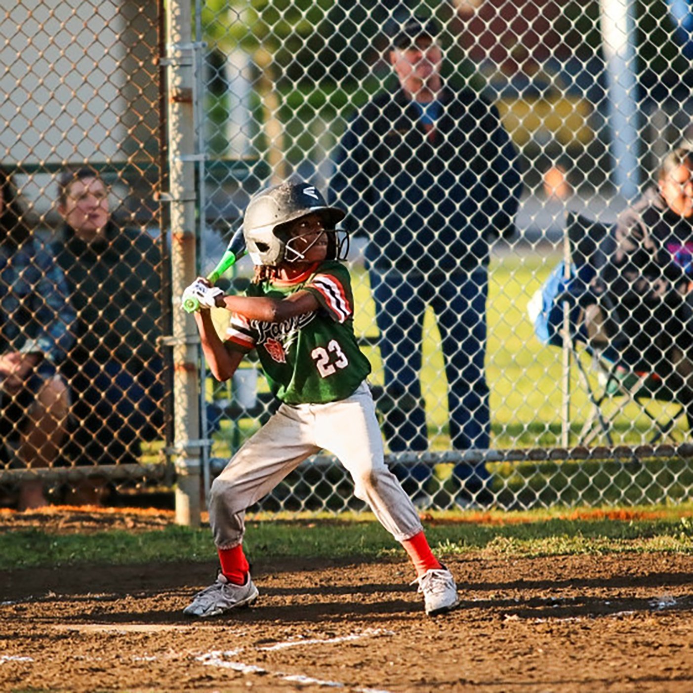 Photo of TBTL Junior Slugger Armani at the plate, about to swing at a pitch