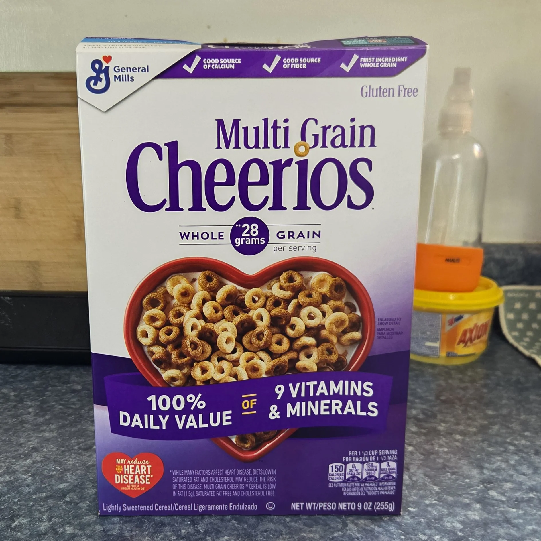 Photo of a box of Multi Grain Cheerios sitting on a kitchen counter