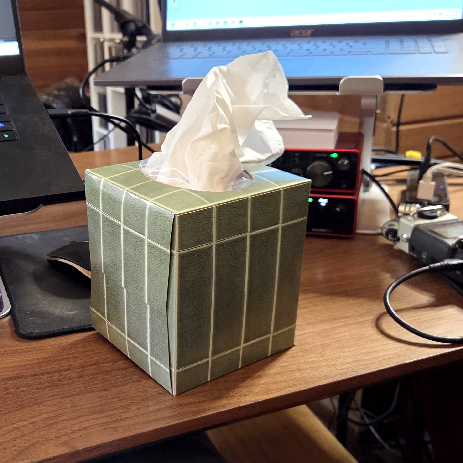 Photo of a cube-style tissue box on Andrew's desk