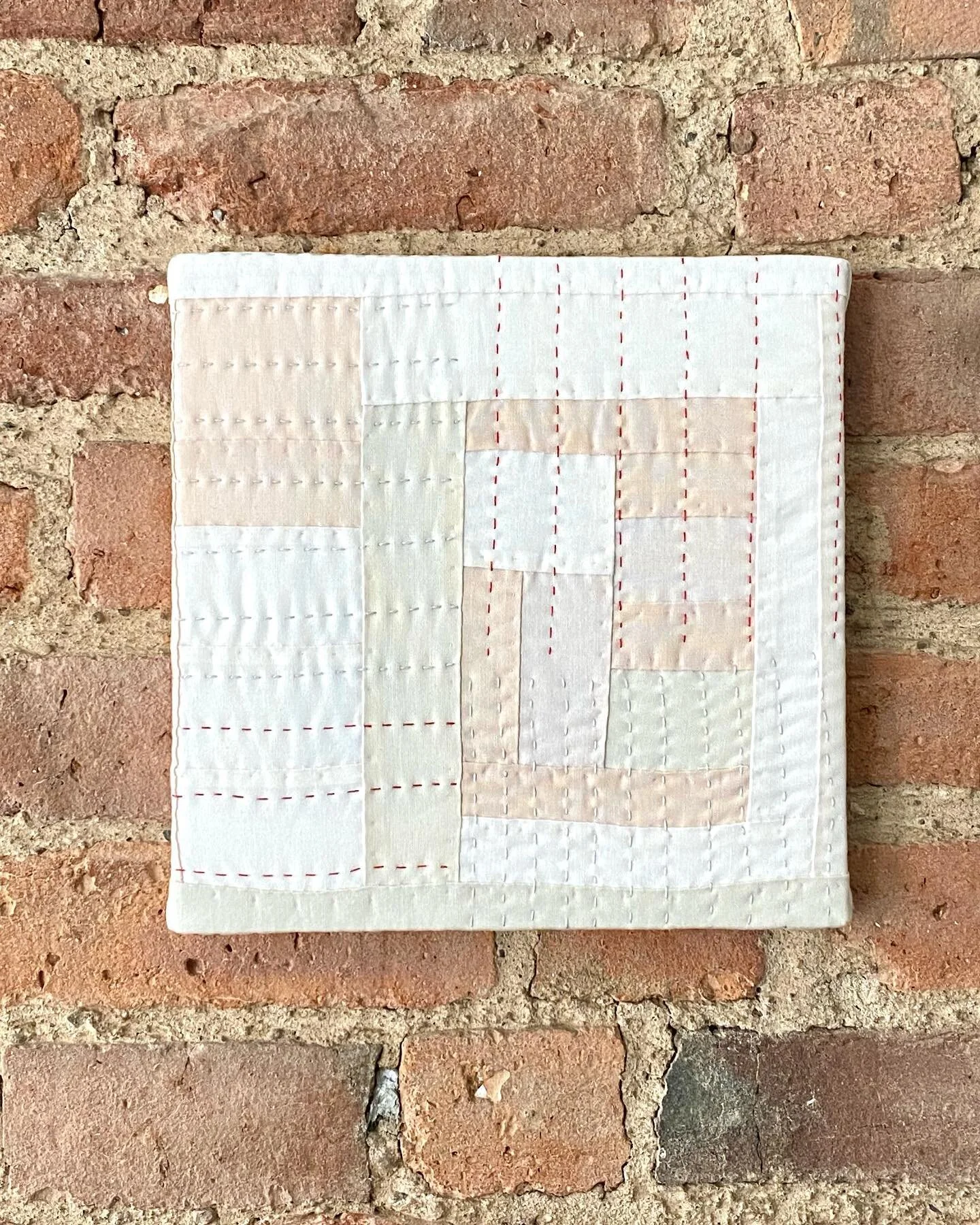 Wall hanging 5 &mdash; Quilted Neutrals
Hand pieced and hand quilted, stretched on a wooden board. 9x9 inches. Available on my website.