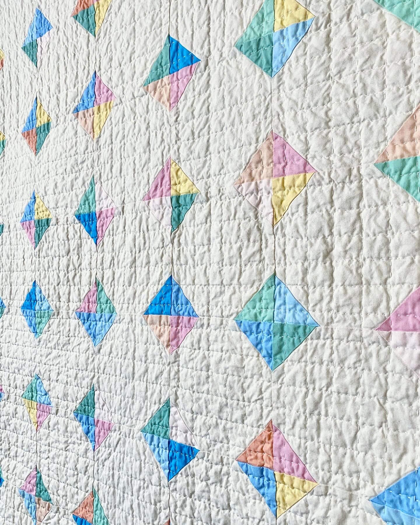 An angled view highlighting the texture from the small hand-quilted grid pattern