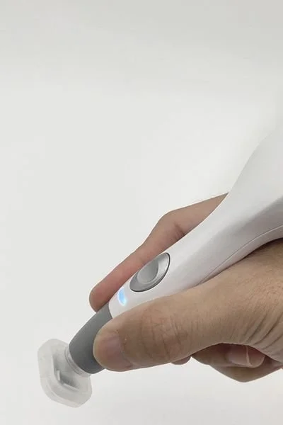 Anna holds Jet Plasma wand before doing a treatment