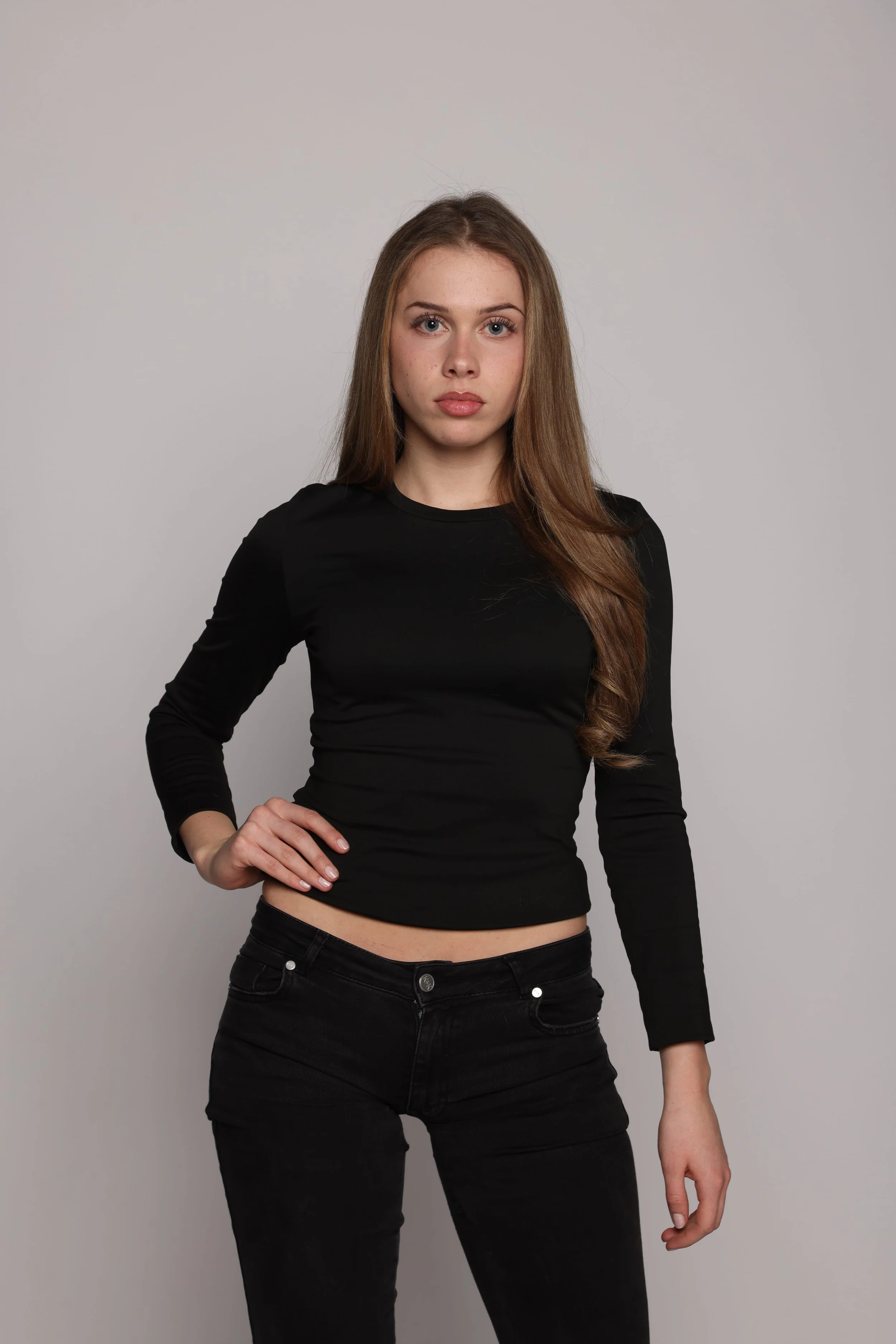 woman black tshirt black jean smiling1.jpg