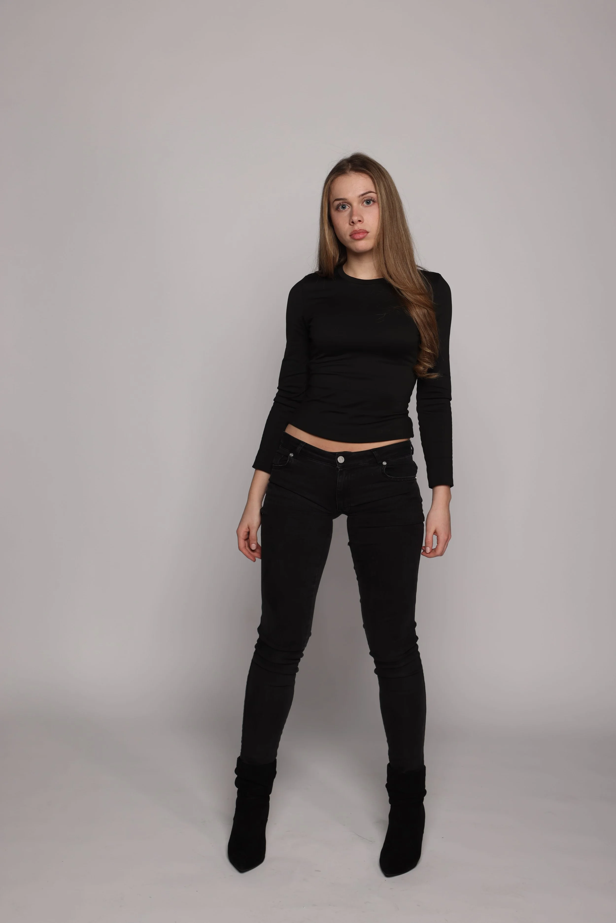 woman black tshirt black jean smiling2.jpg