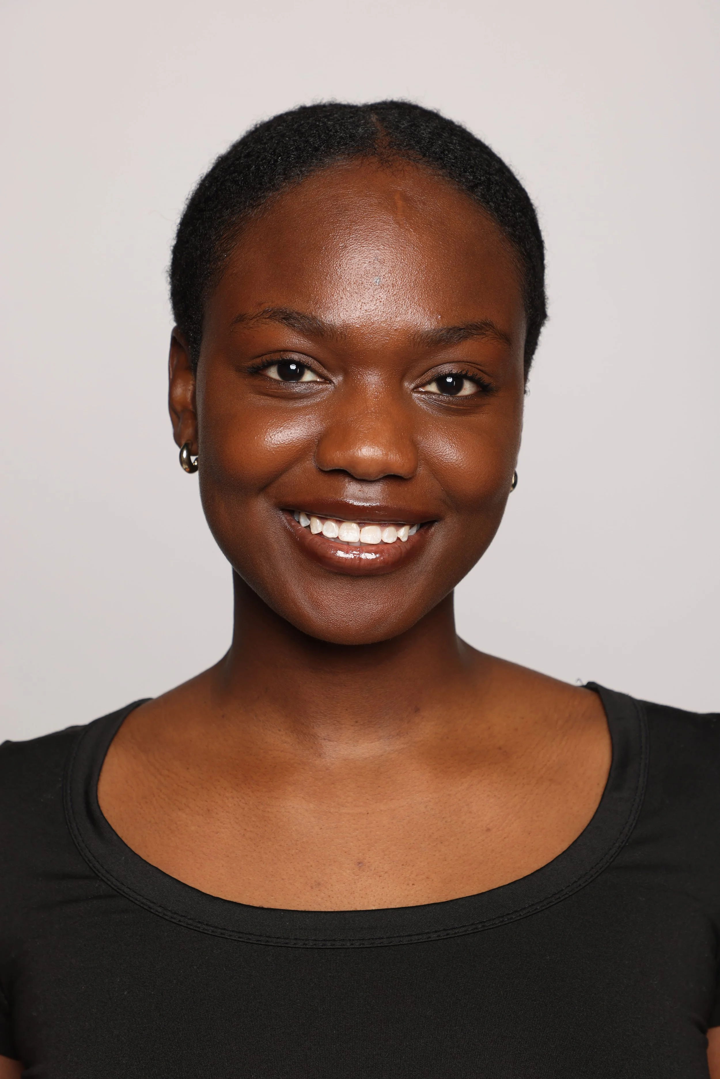 woman black tshirt black jean smiling4.jpg