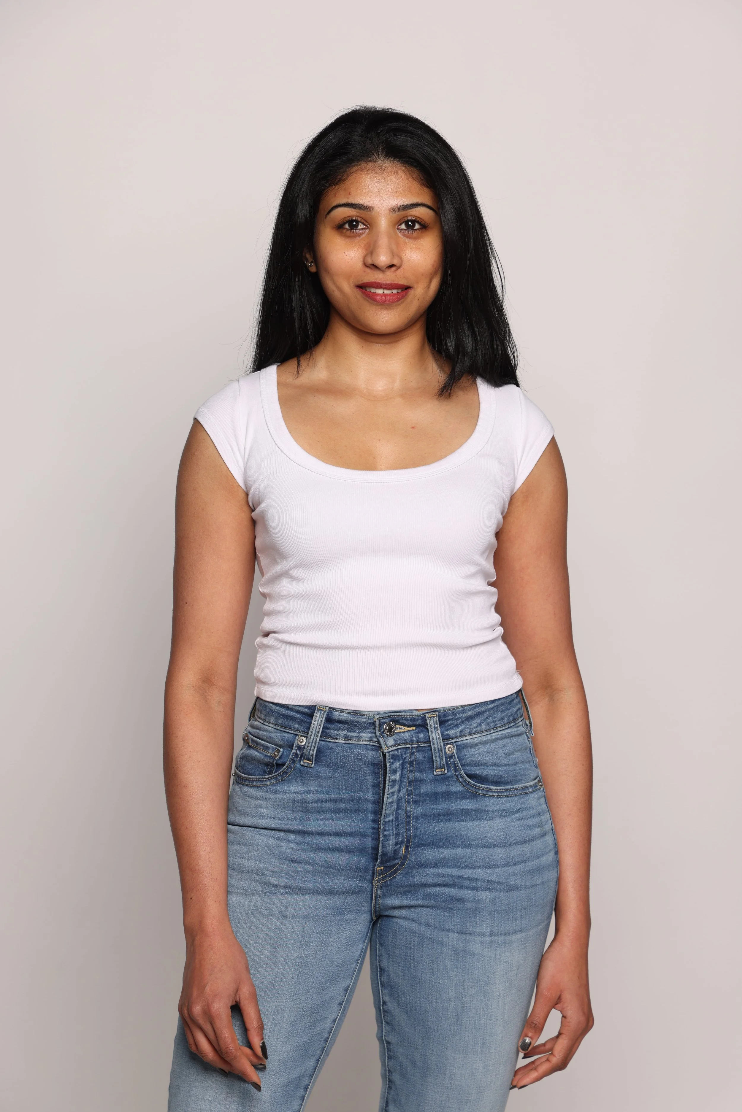 woman white tshirt blue jean smiling2.jpg