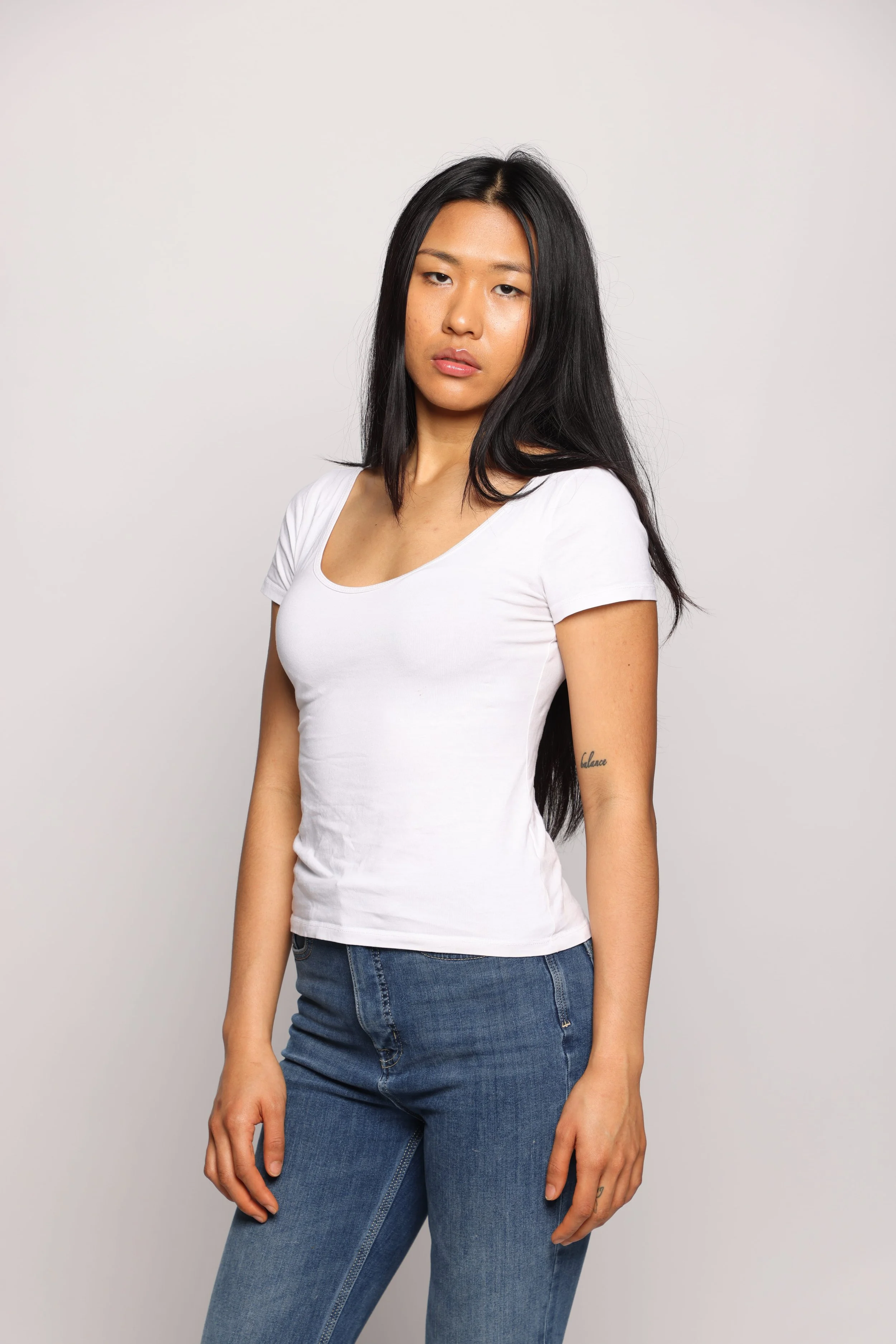woman white tshirt blue jean smiling2.jpg