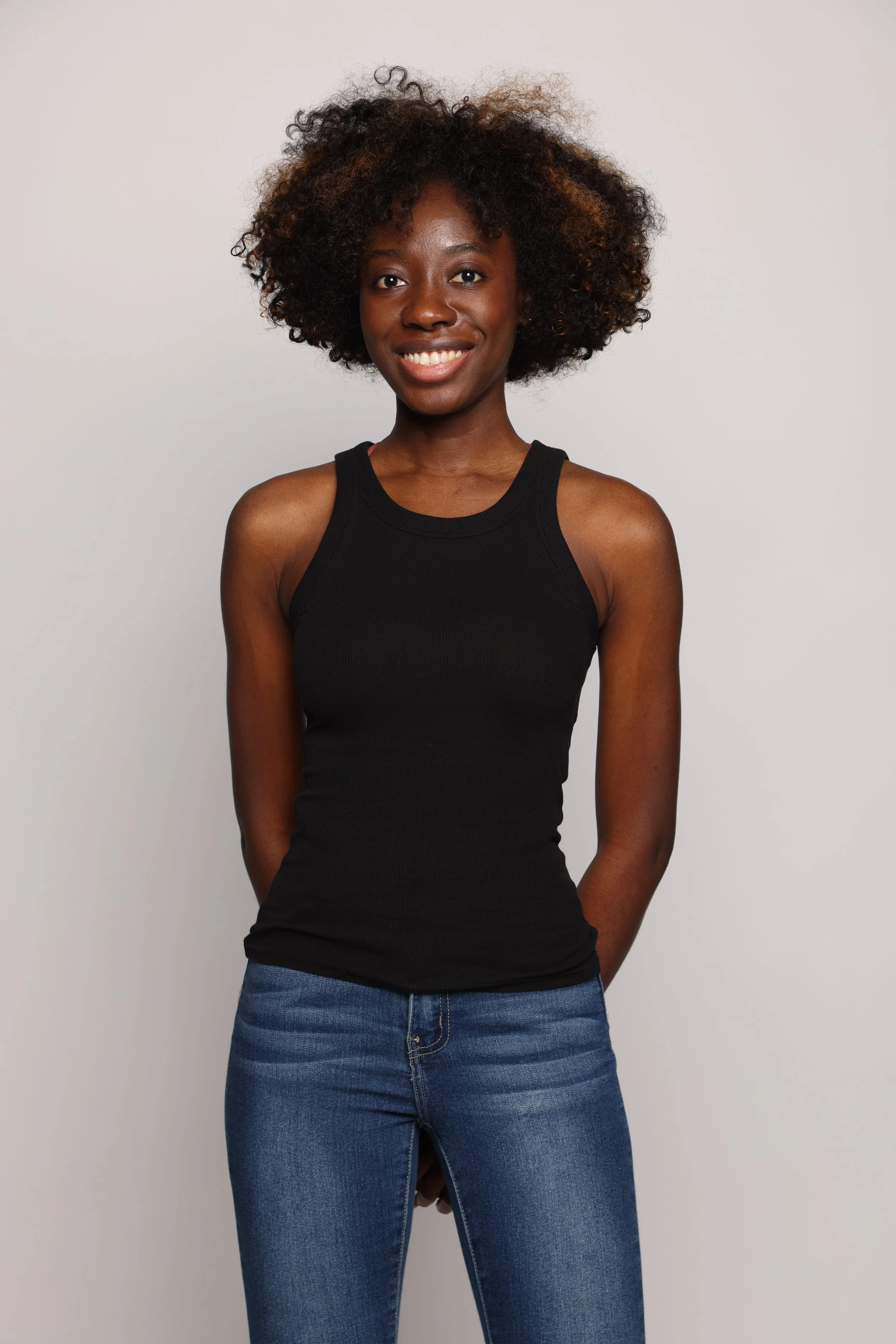 woman black tshirt black jean smiling2.jpg