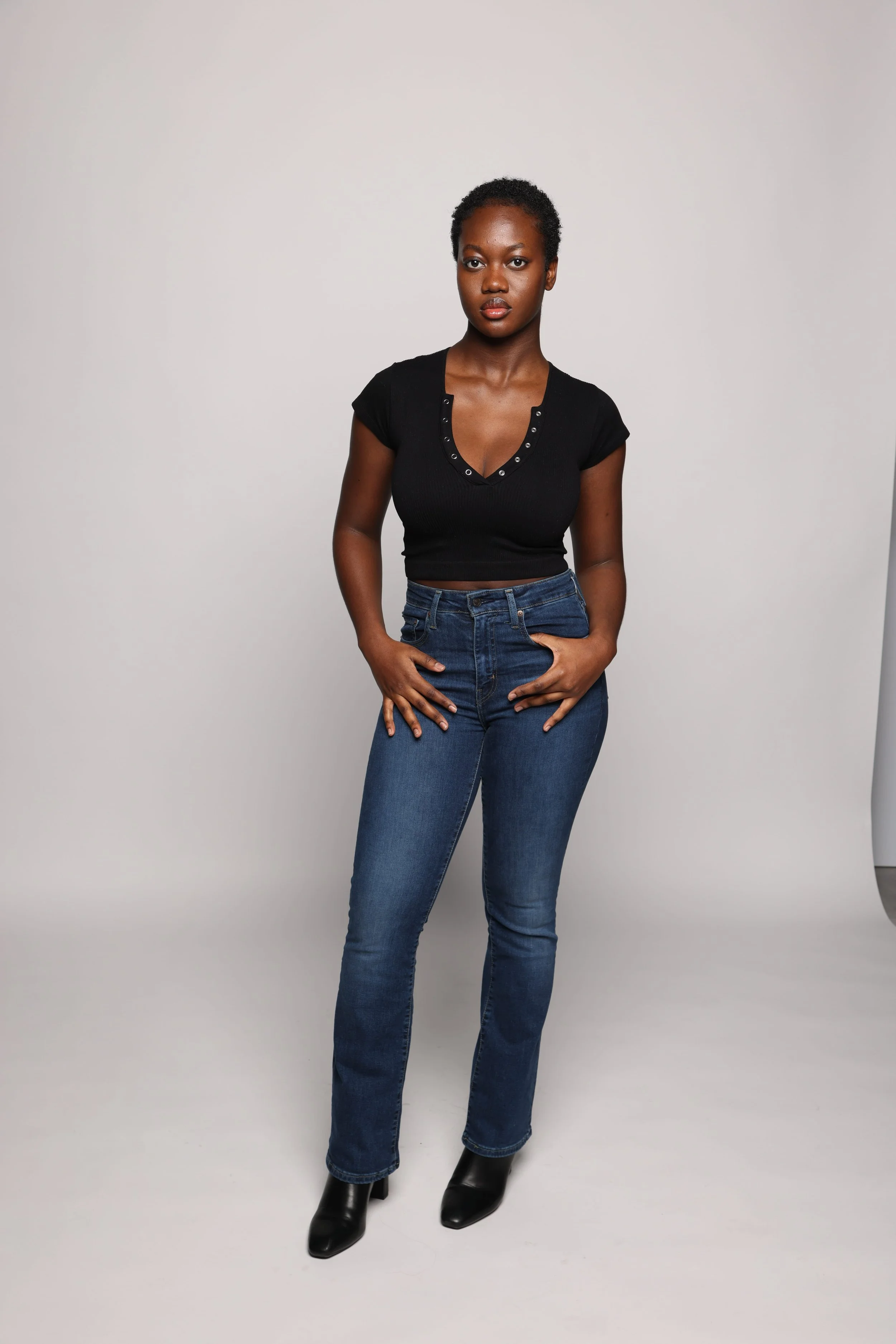 woman black tshirt blue jean smiling1.jpg