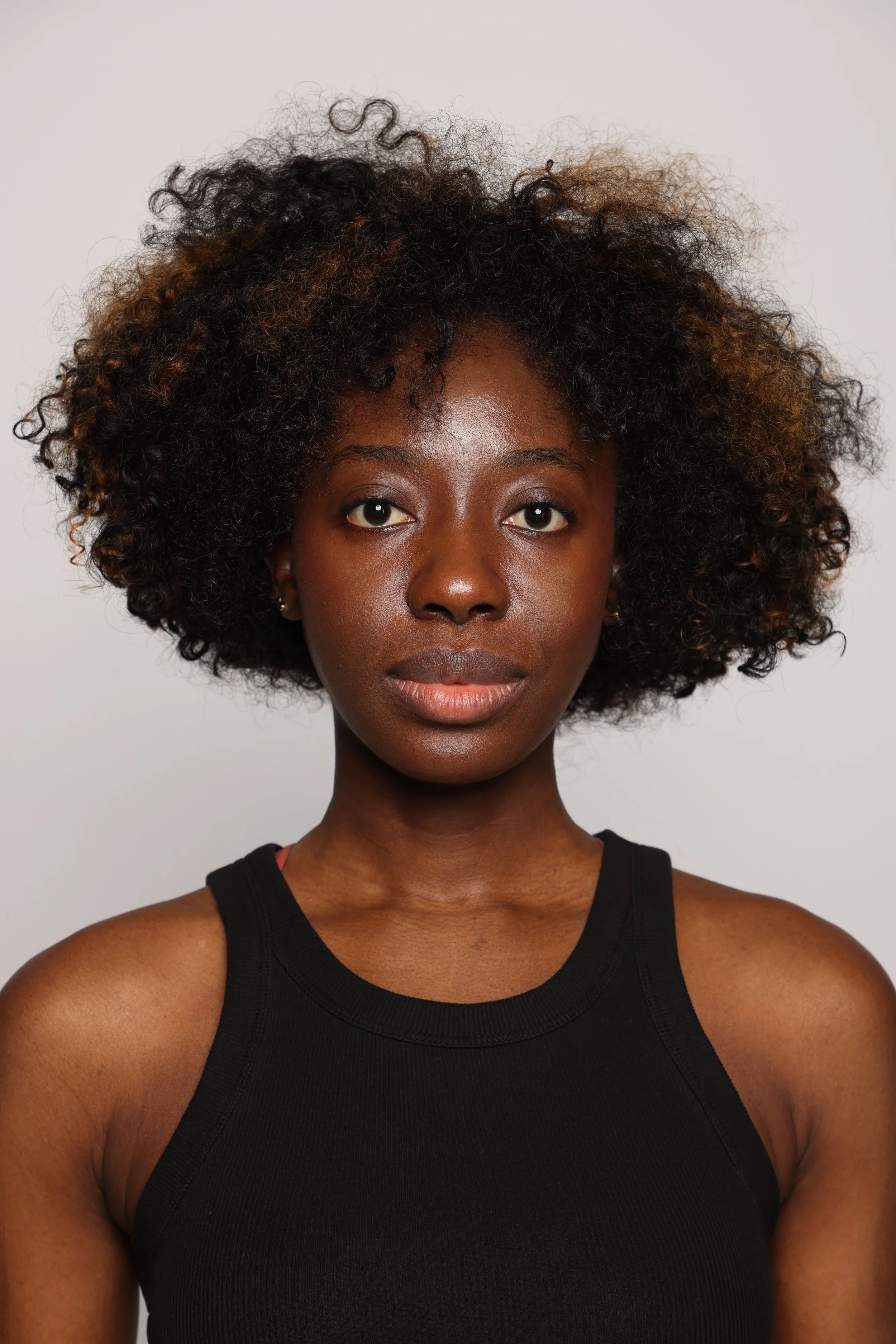 woman black tshirt black jean smiling3.jpg