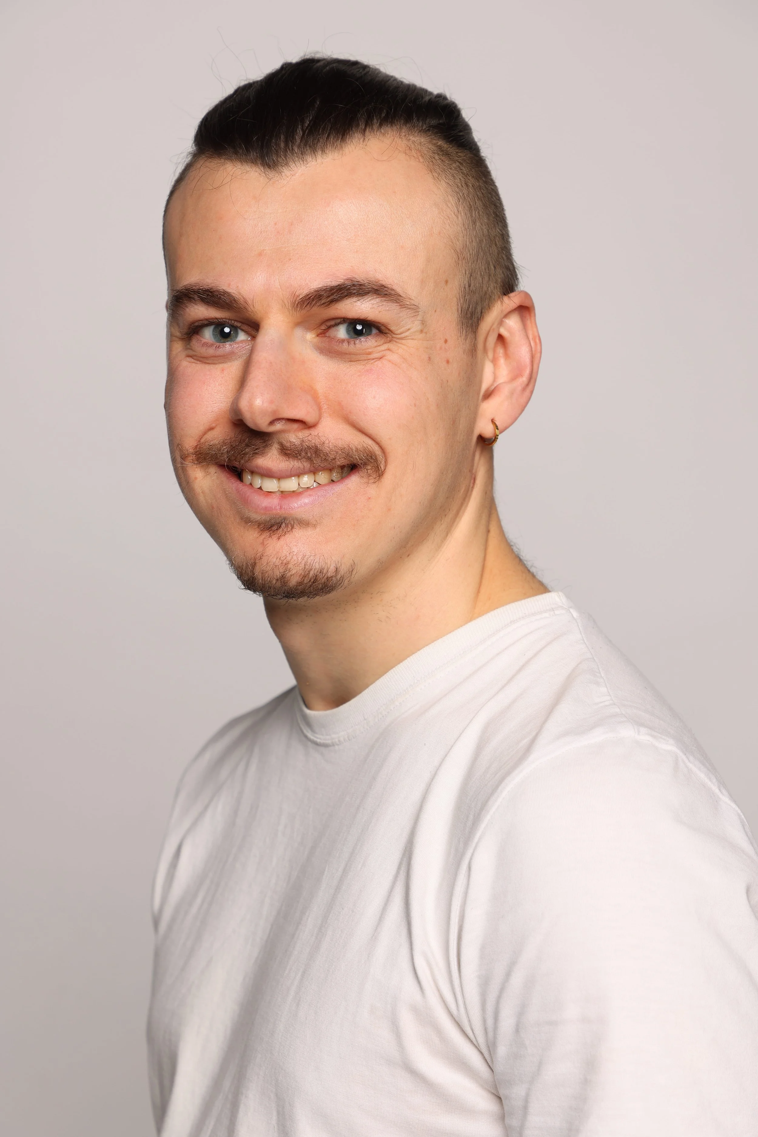 man white tshirt black jean smiling2.jpg