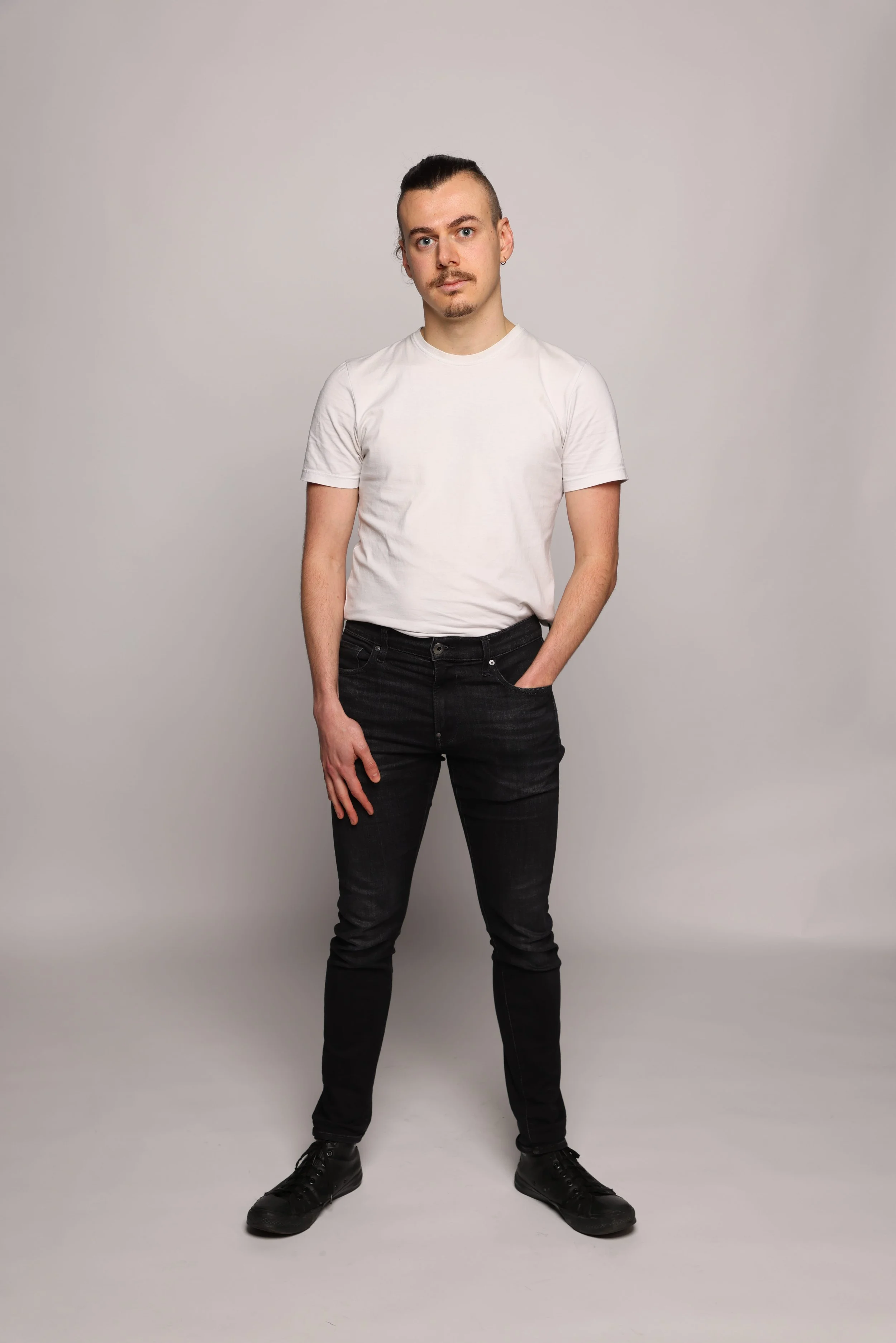 man white tshirt black jean smiling1.jpg