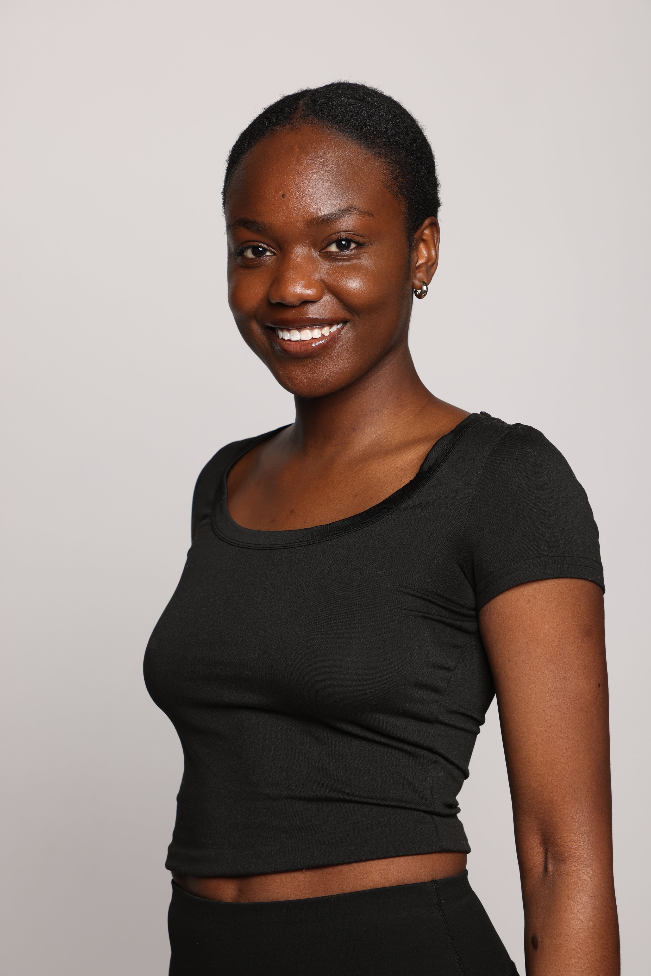 woman black tshirt black jean smiling2.jpg