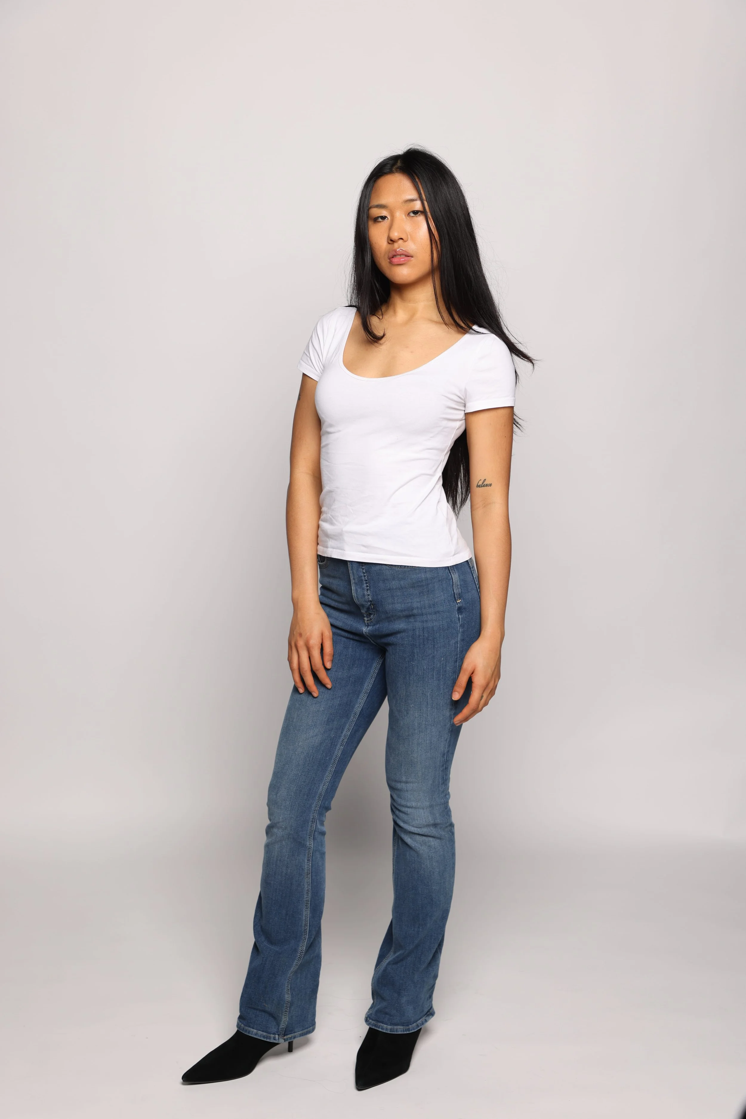 woman white tshirt blue jean smiling1.jpg