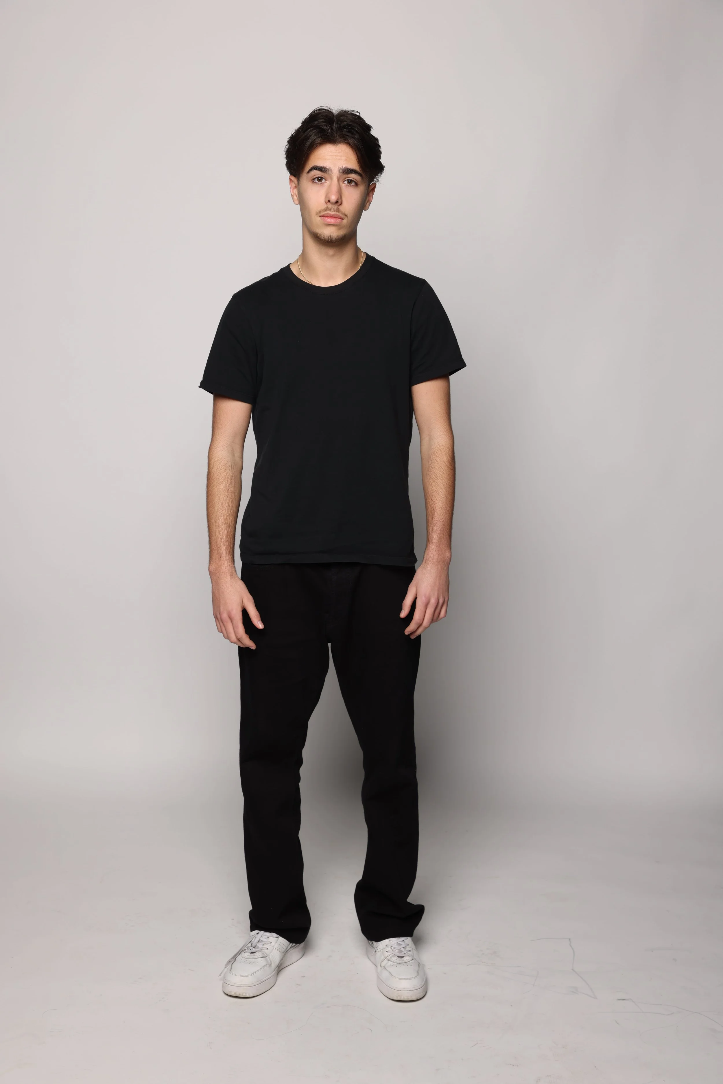 man black tshirt black jean smiling1.jpg