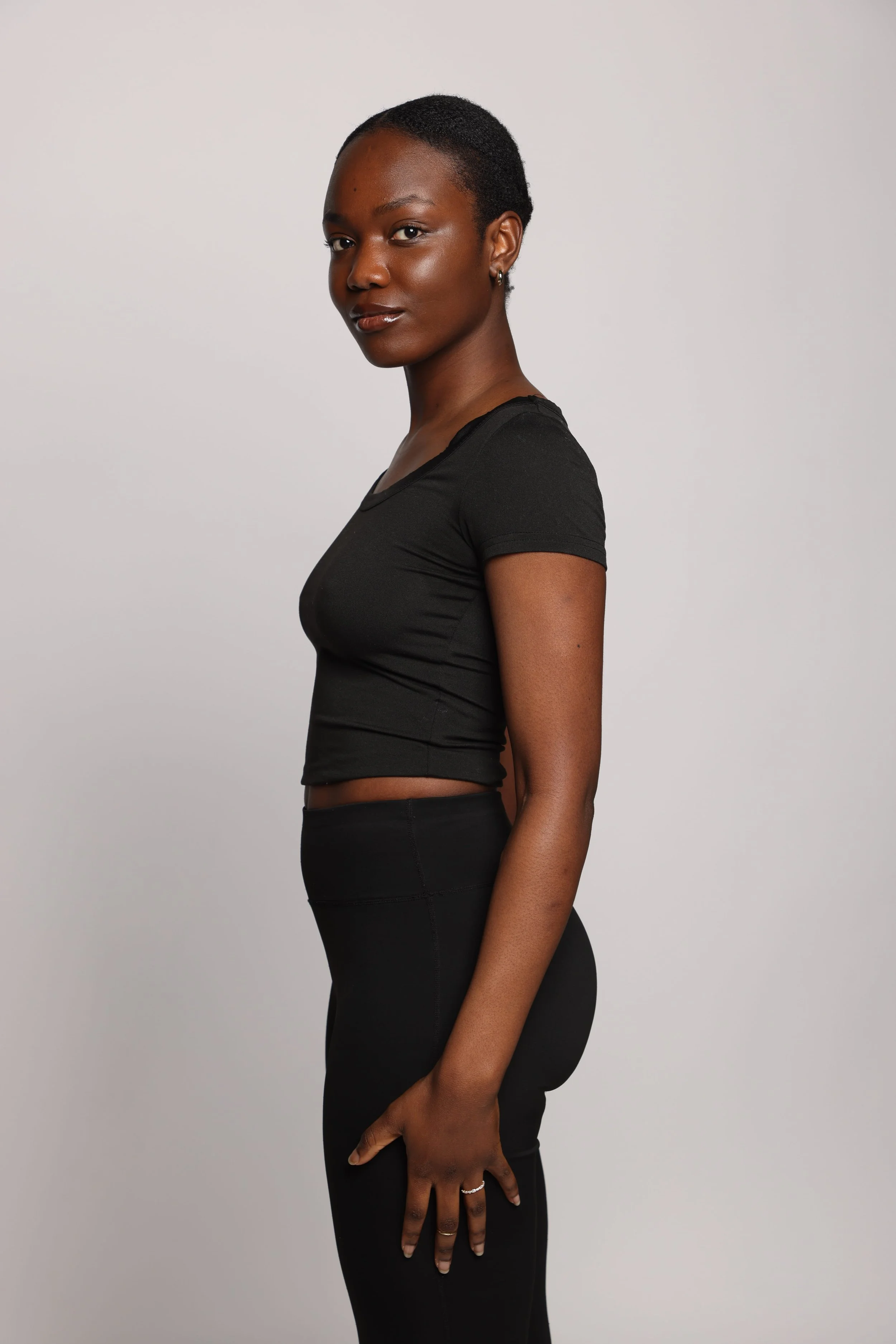 woman black tshirt black jean smiling1.jpg