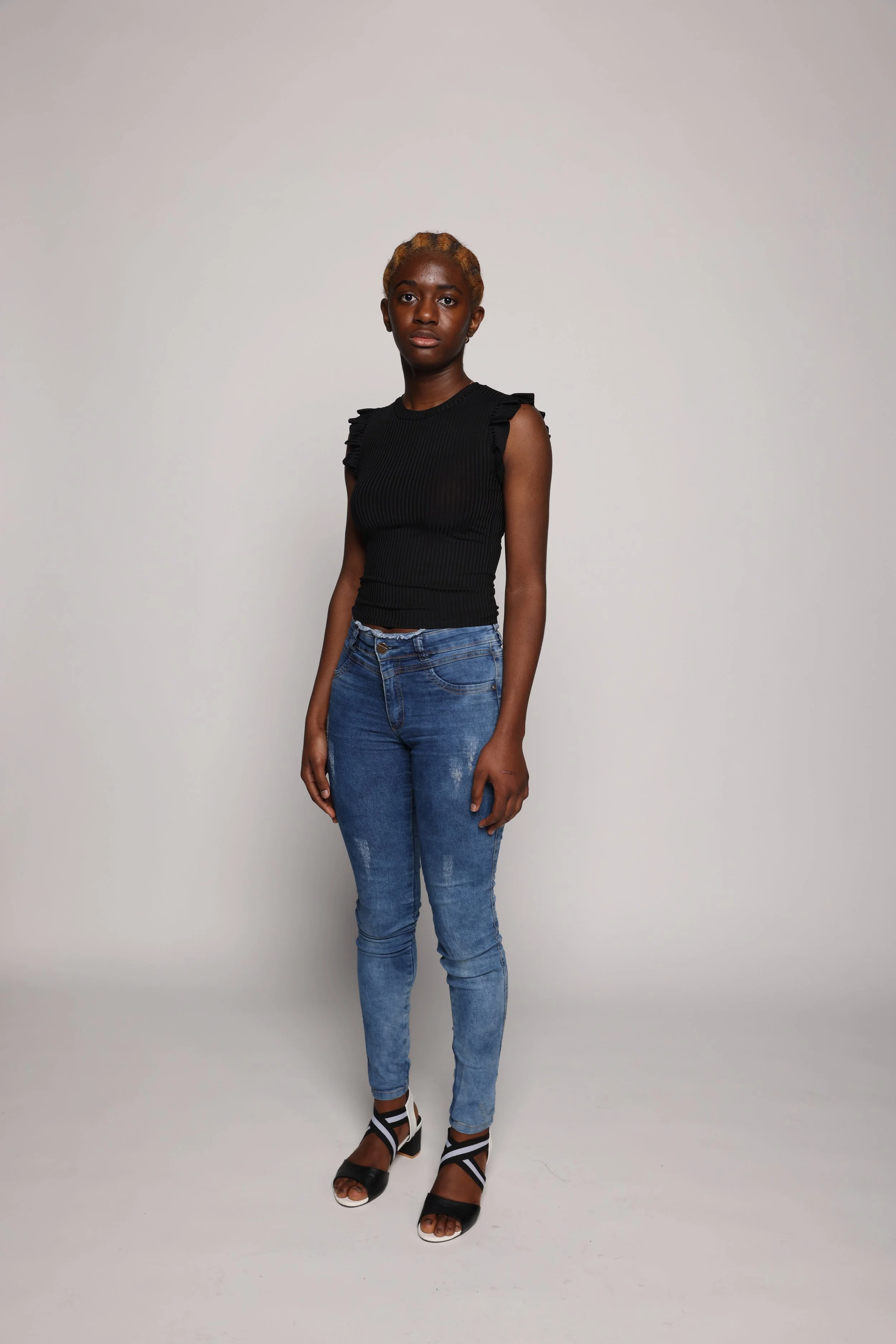 woman black tshirt blue jean smiling4.jpg