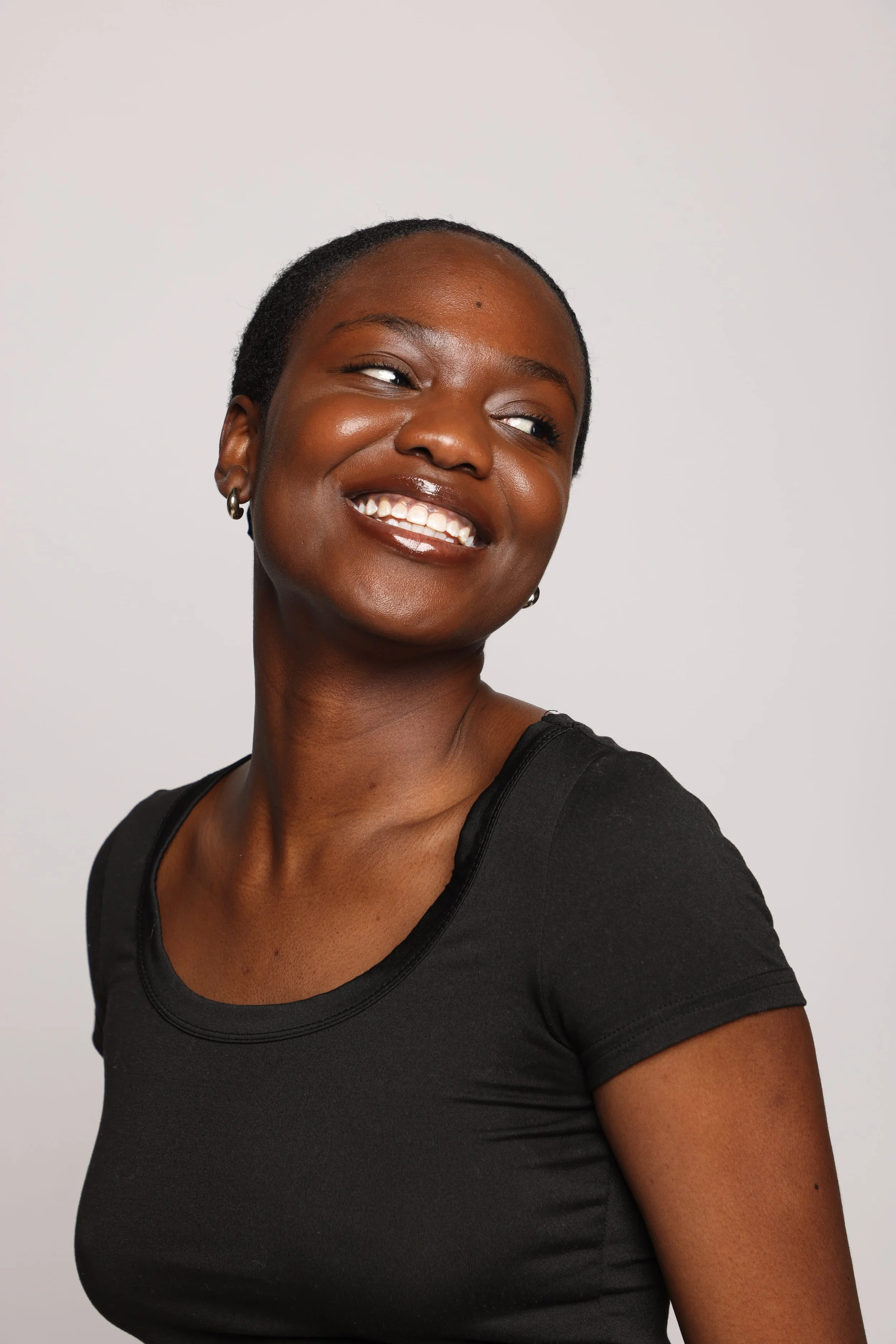 woman black tshirt black jean smiling3.jpg