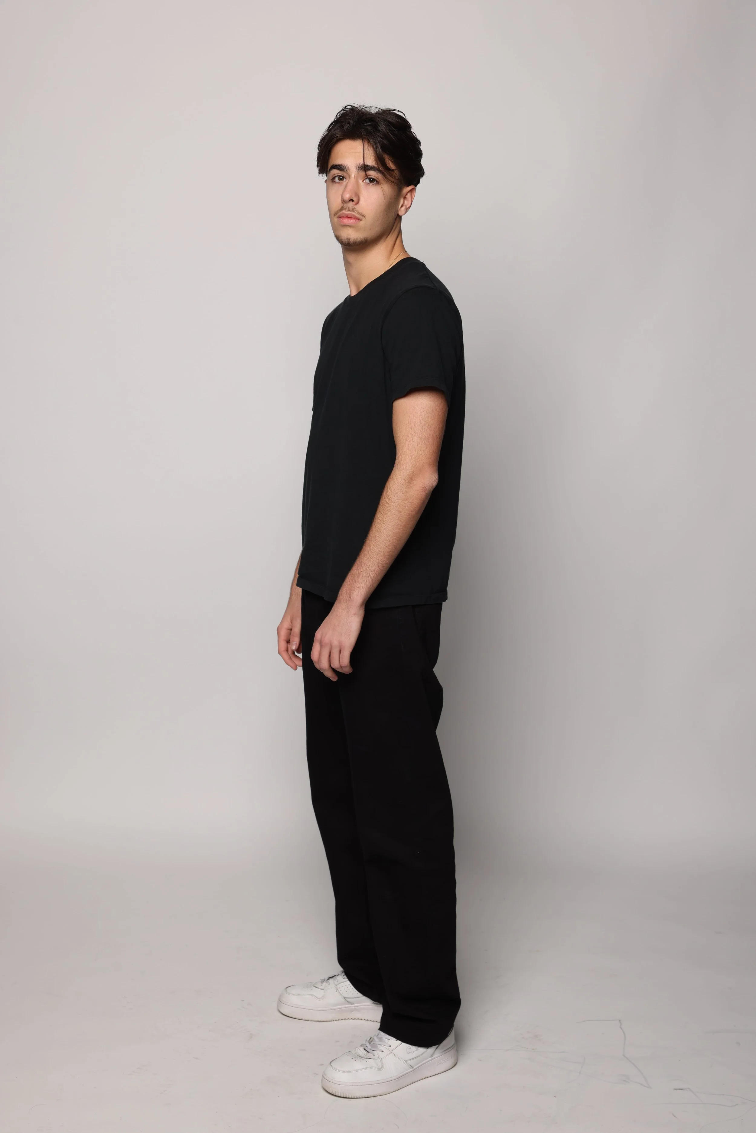 man black tshirt black jean smiling2.jpg