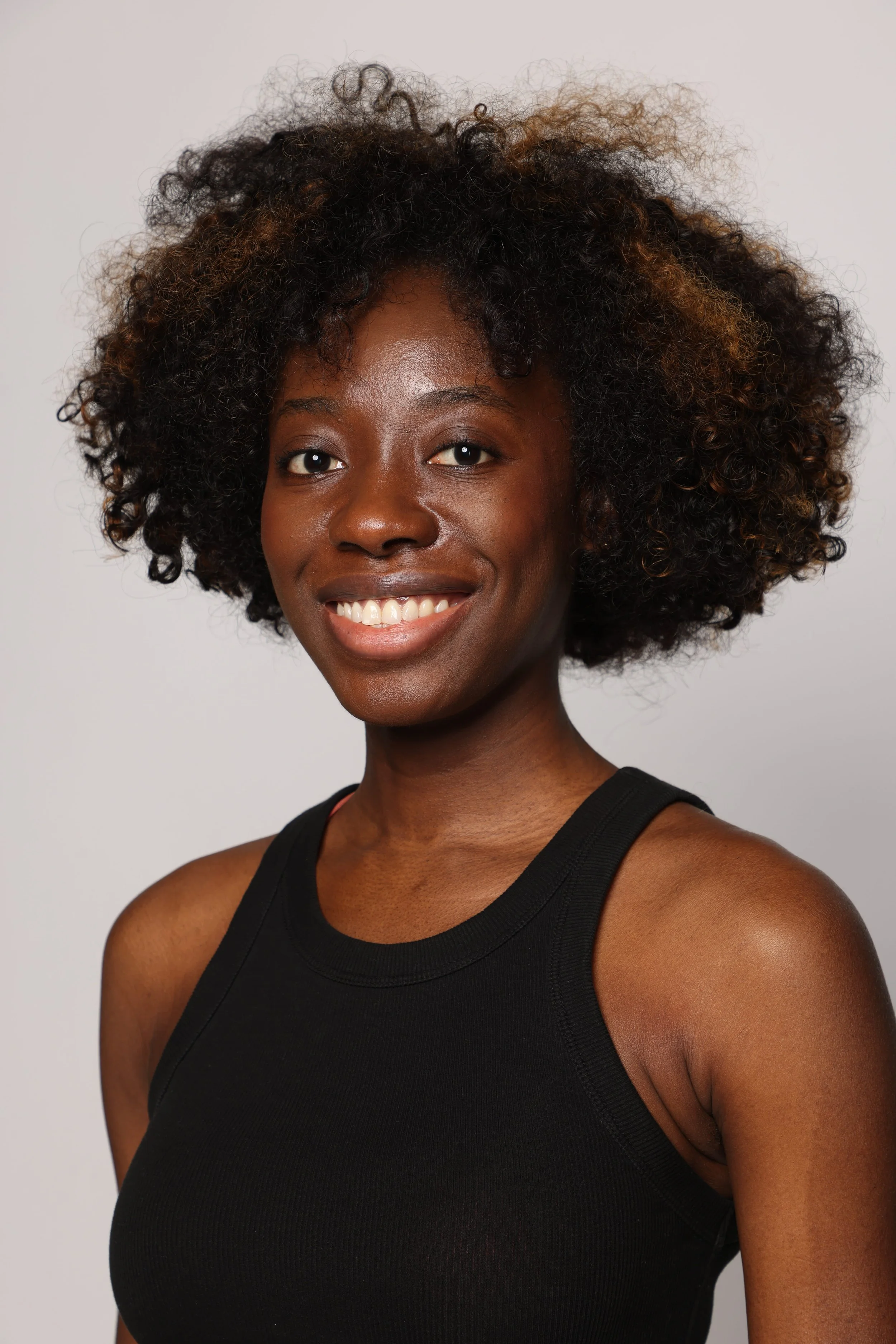 woman black tshirt black jean smiling4.jpg