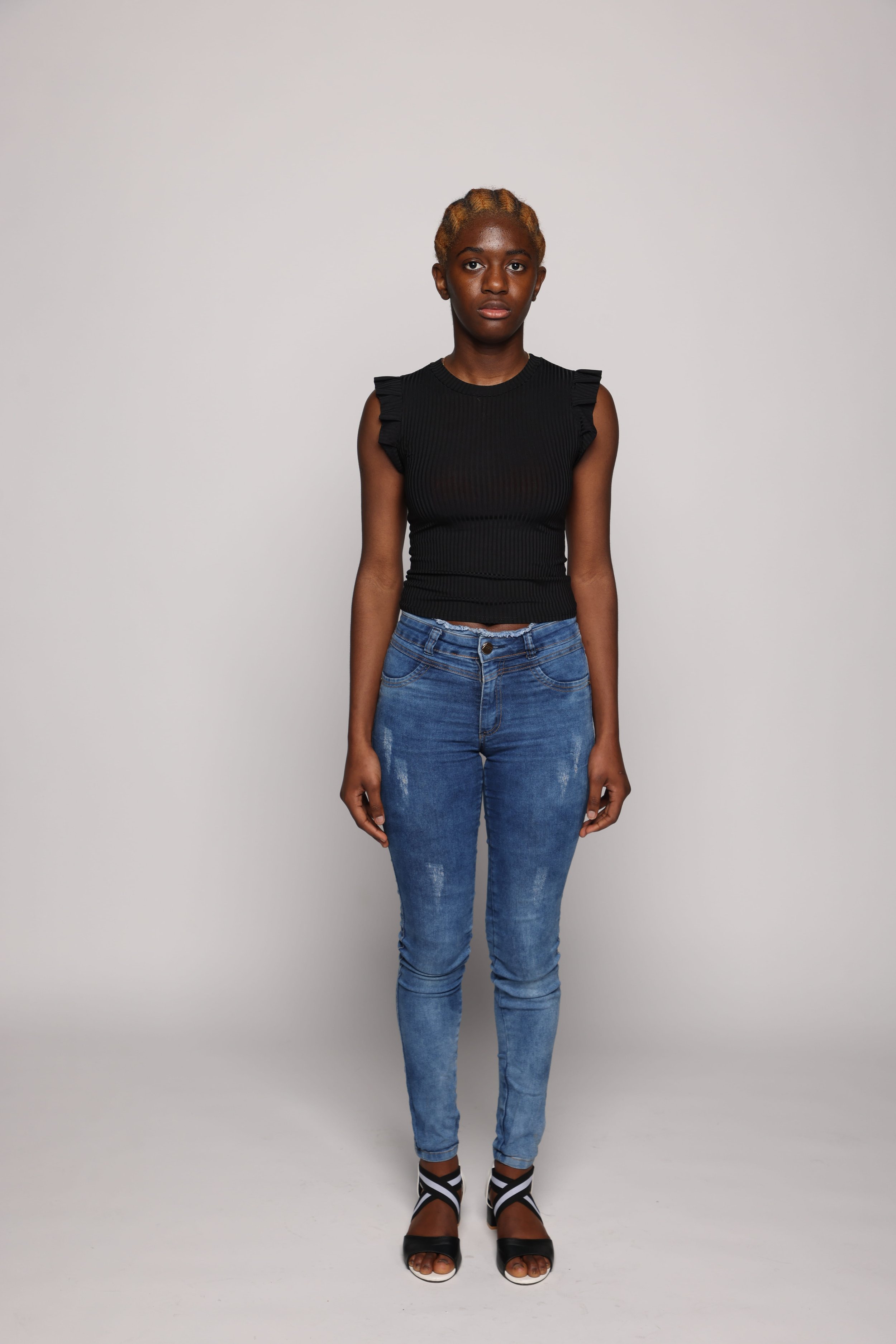 woman black tshirt blue jean smiling1.jpg