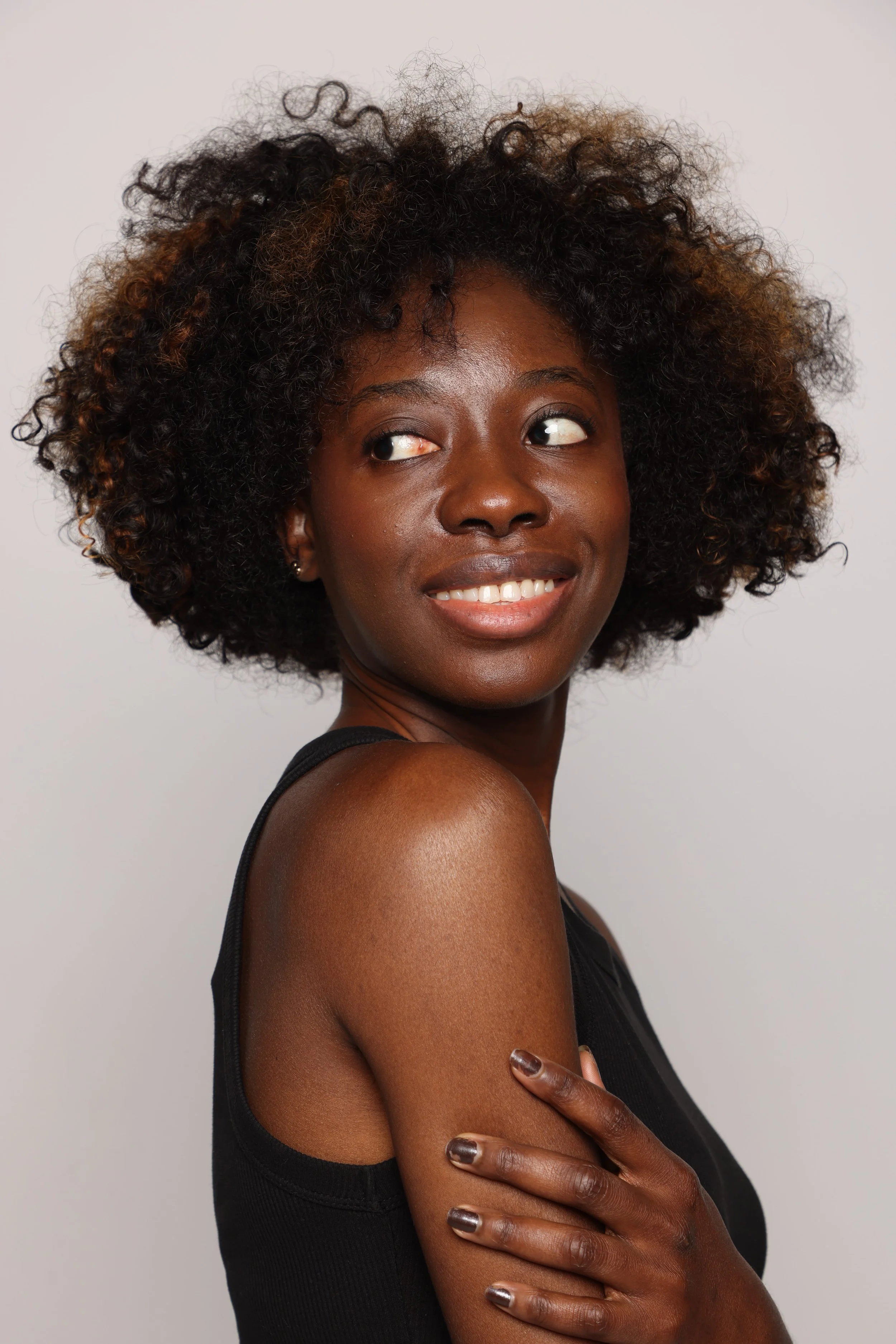 woman black tshirt black jean smiling5.jpg