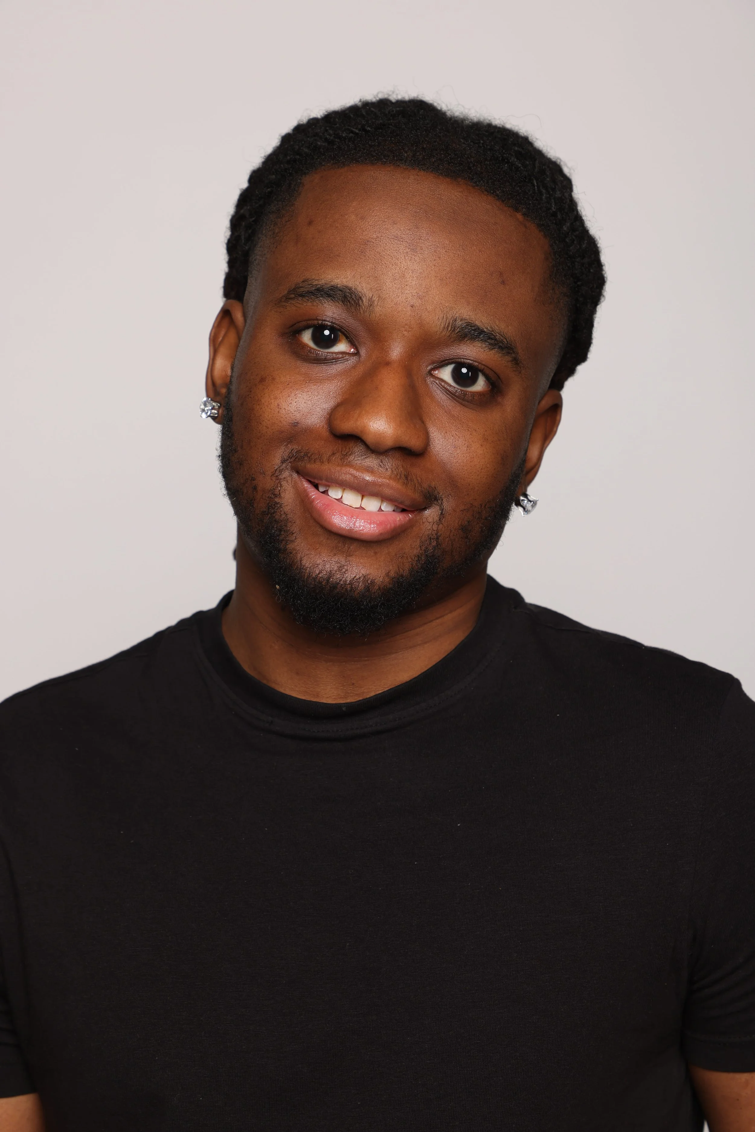 short hair man black tshirt black pants smiling3.jpg