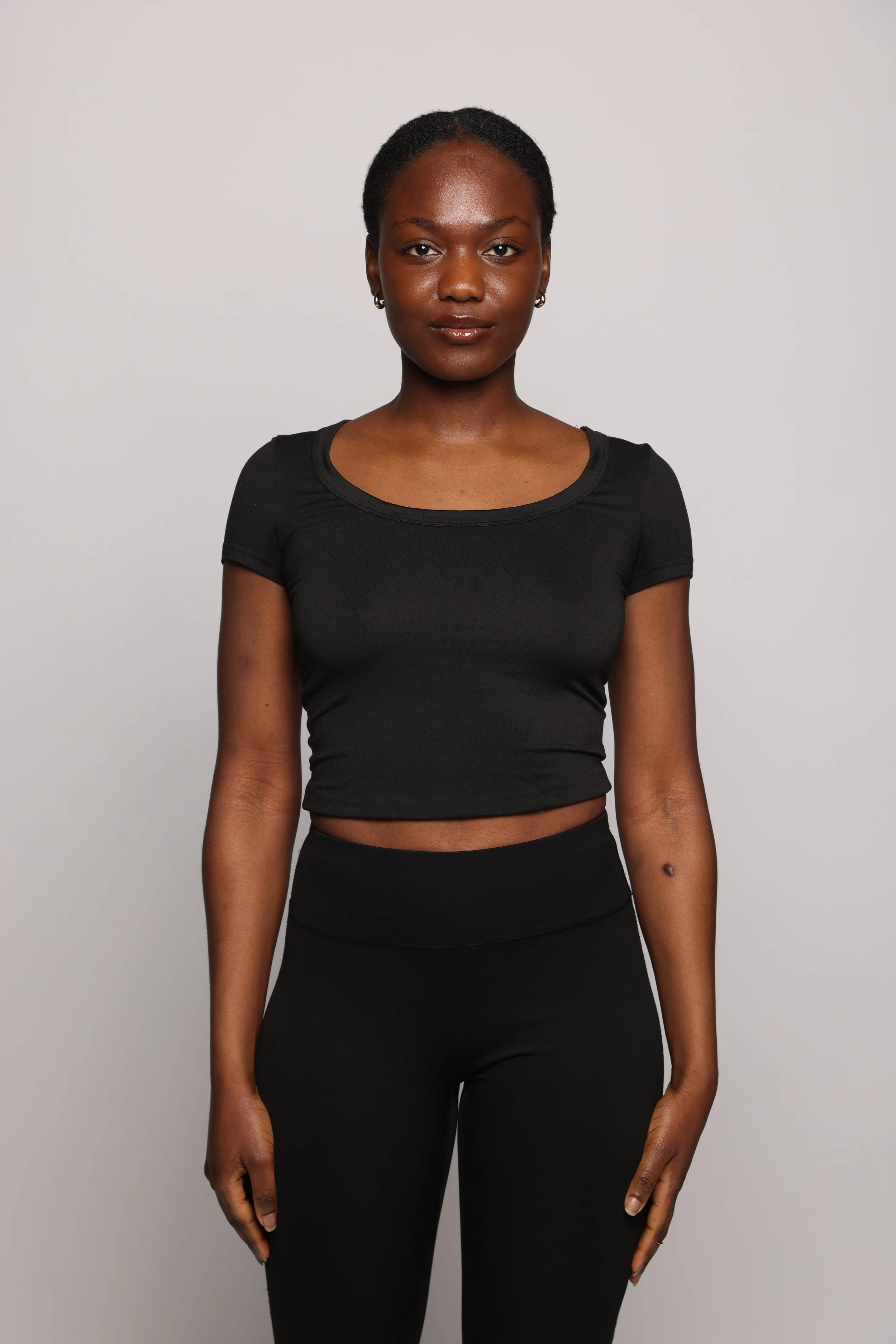 woman black tshirt black jean smiling6.jpg