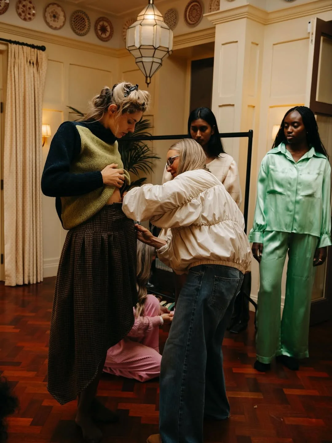 BTS look at modern heritage design by Aoife, as a model is styled before the Ireland Fashion Week 2026 runway show