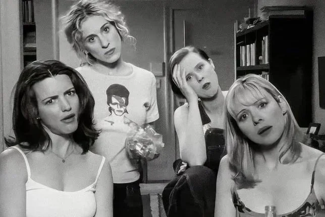 4 women looking into a camera with a shocked facial expressions