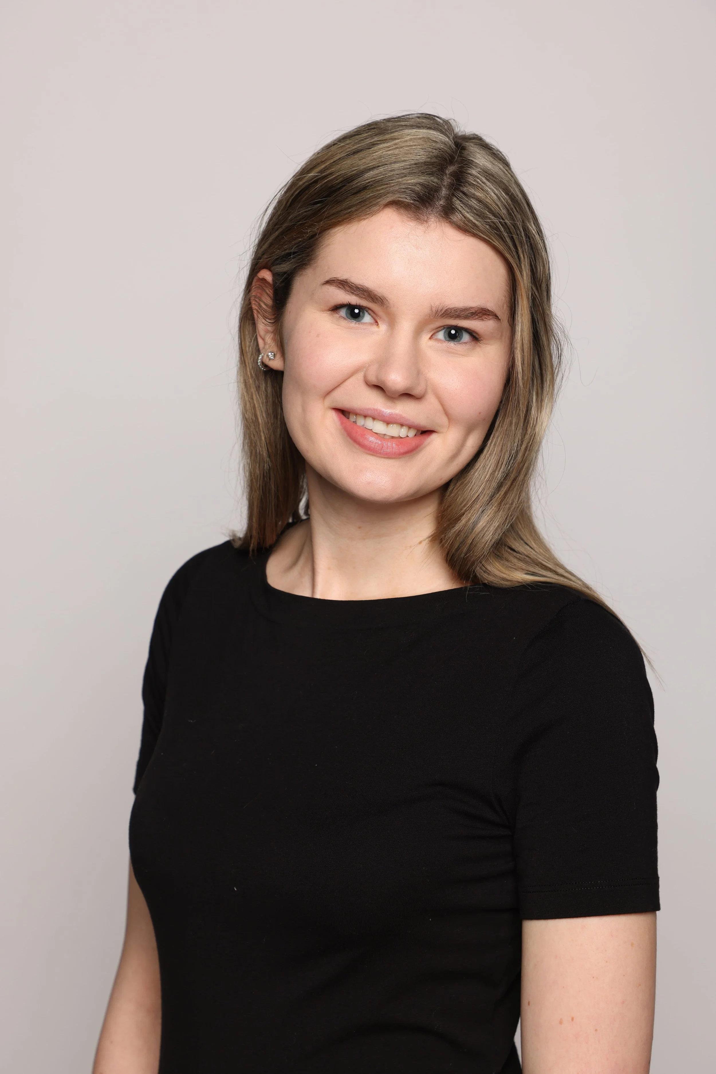 woman black tshirt black jean smiling5.jpg