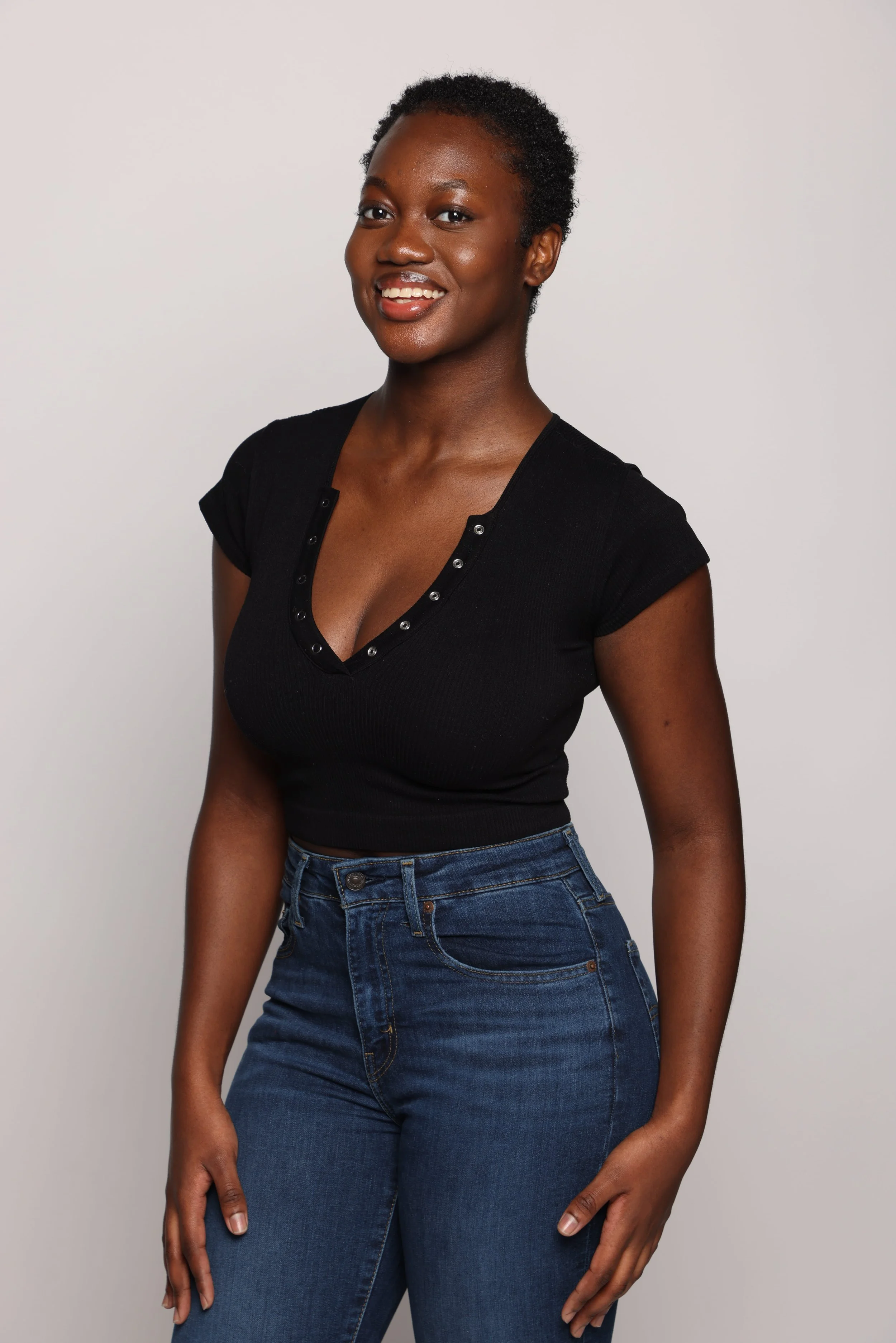 woman black tshirt blue jean smiling2.jpg