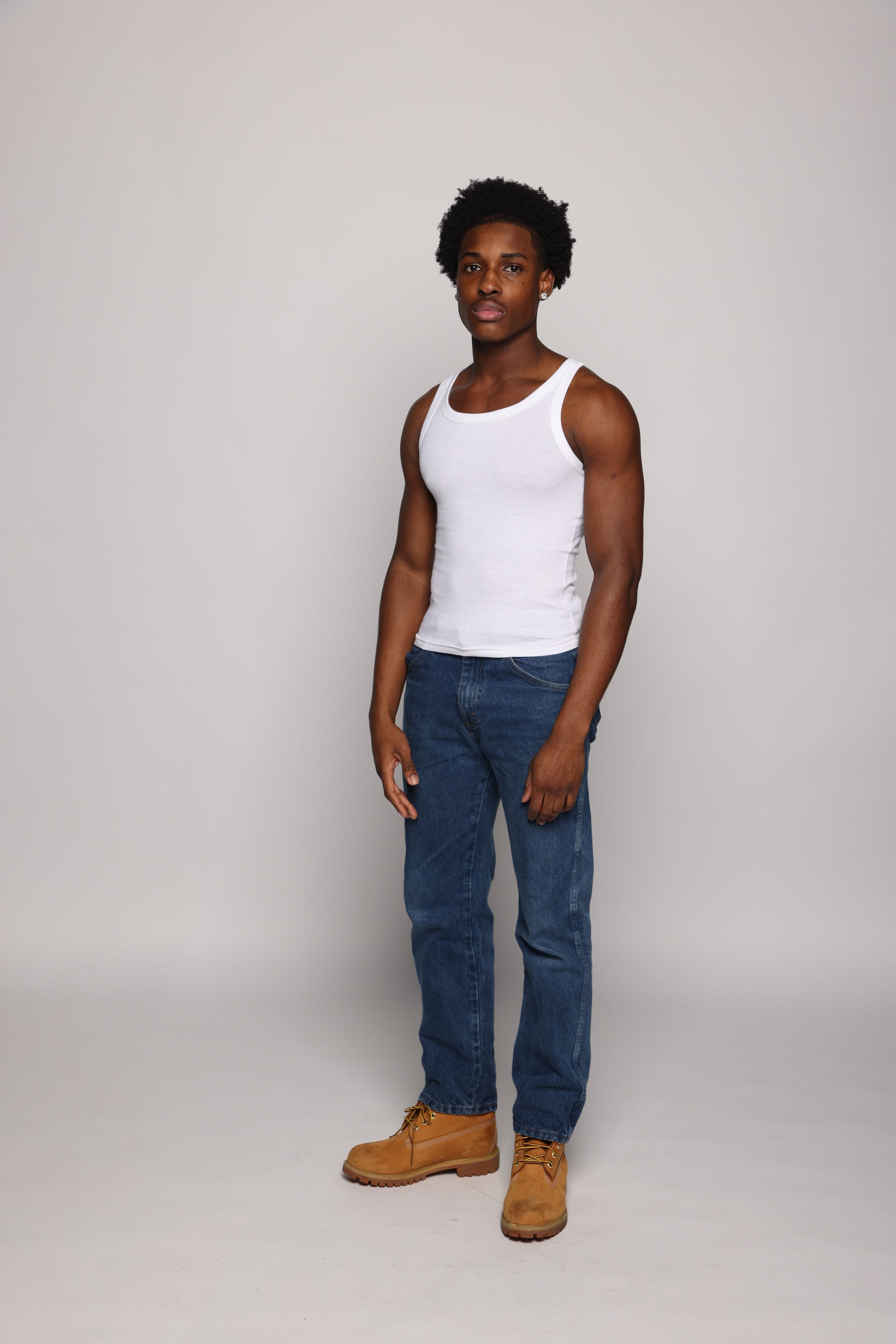 man white tank top blue jean smiling1.jpg