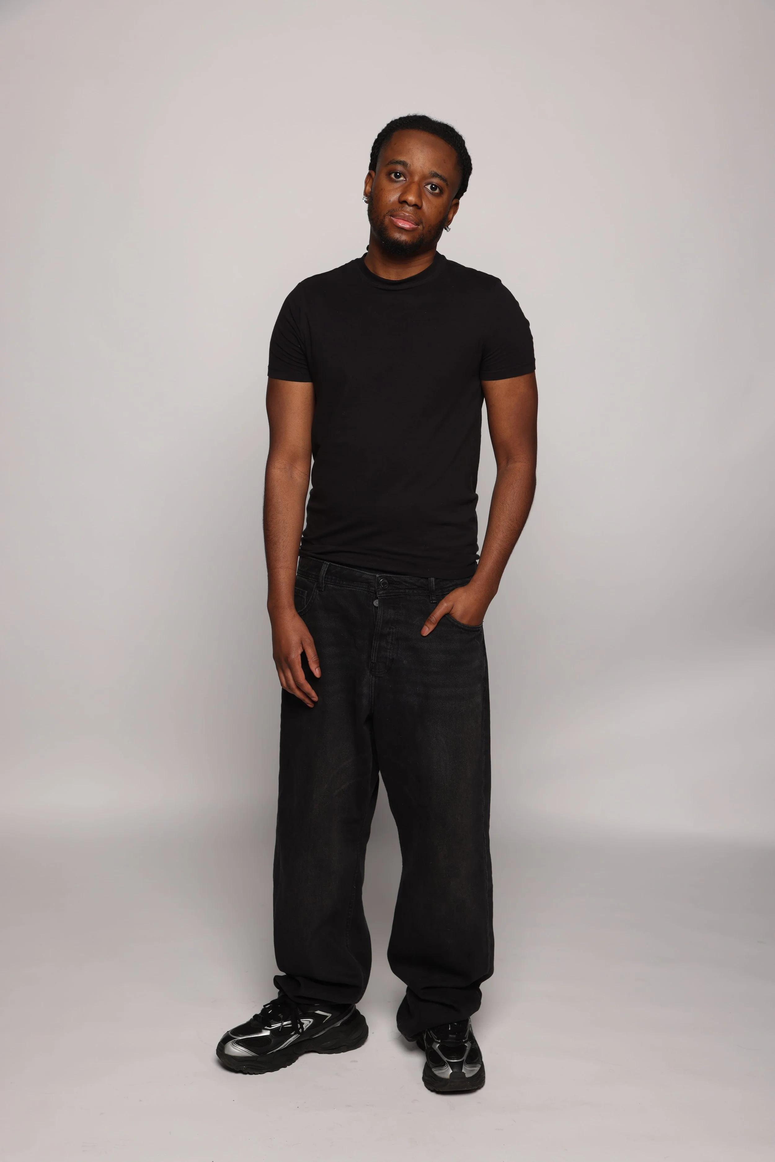 short hair man black tshirt black pants smiling4.jpg