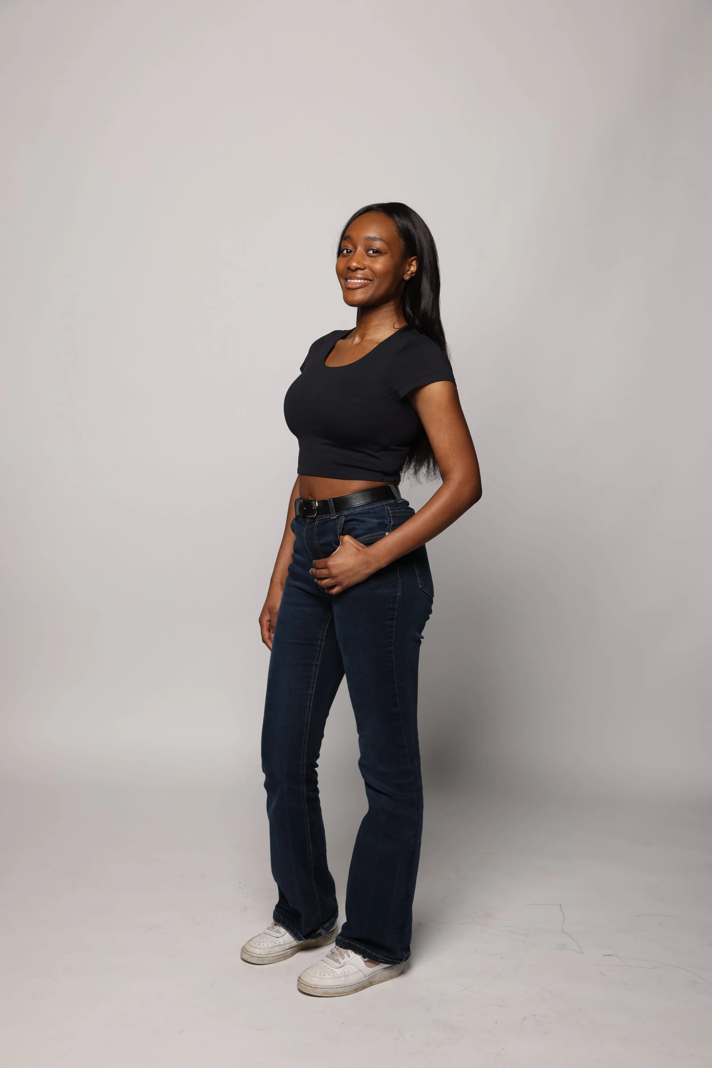 woman black tshirt black pants smiling2.jpg