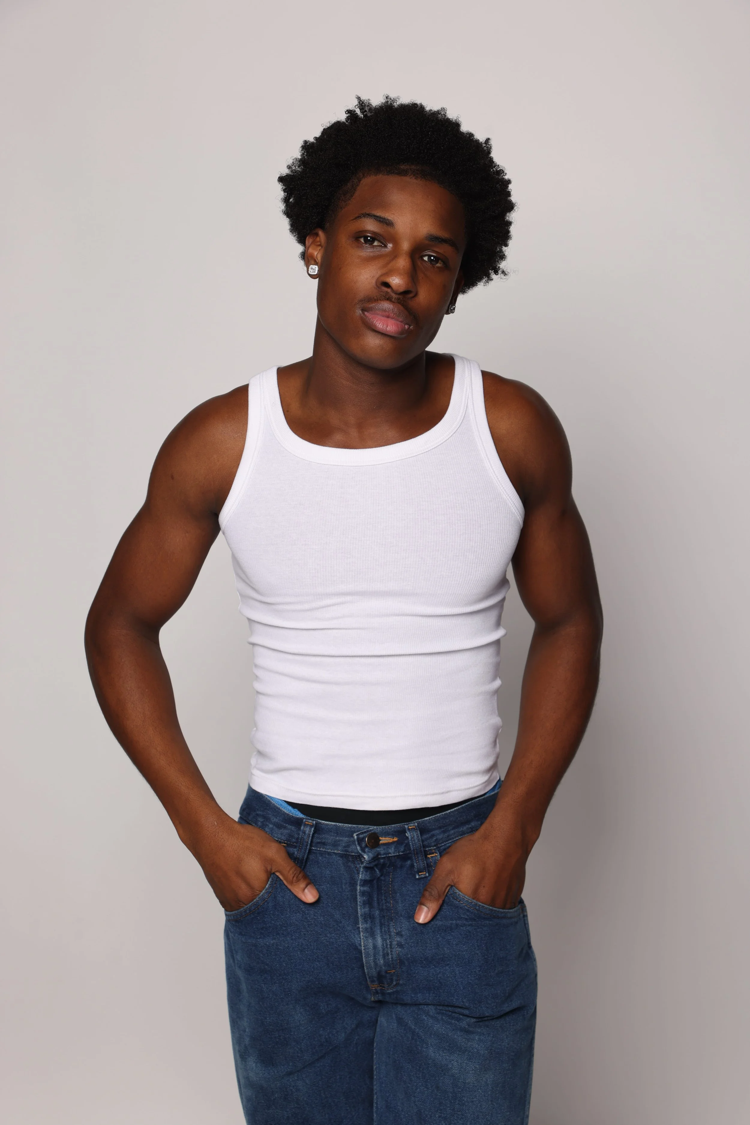 man white tank top blue jean smiling3.jpg