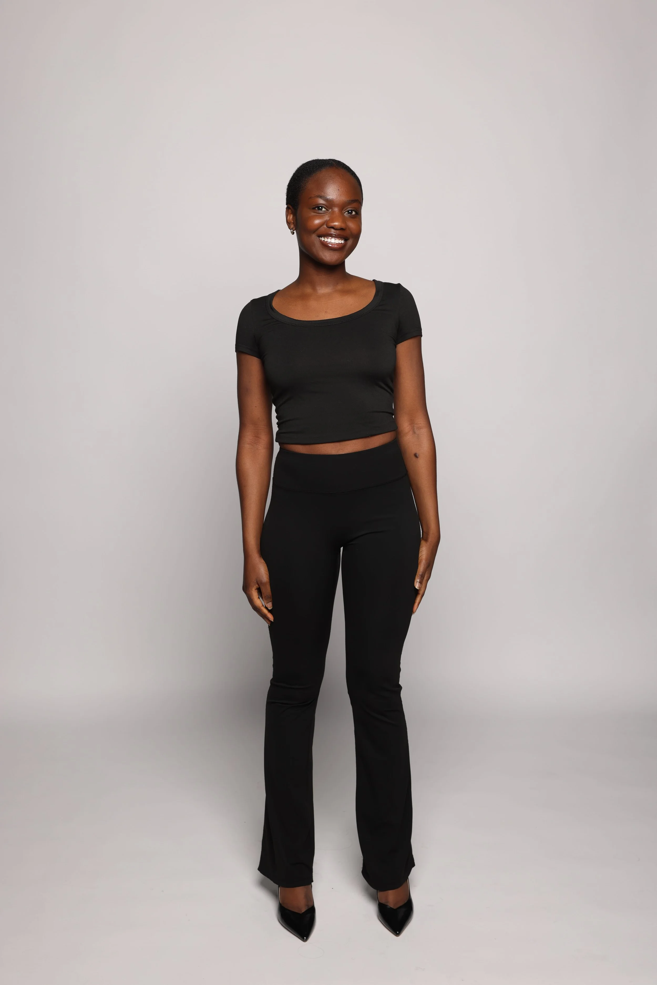 woman black tshirt black jean smiling5.jpg