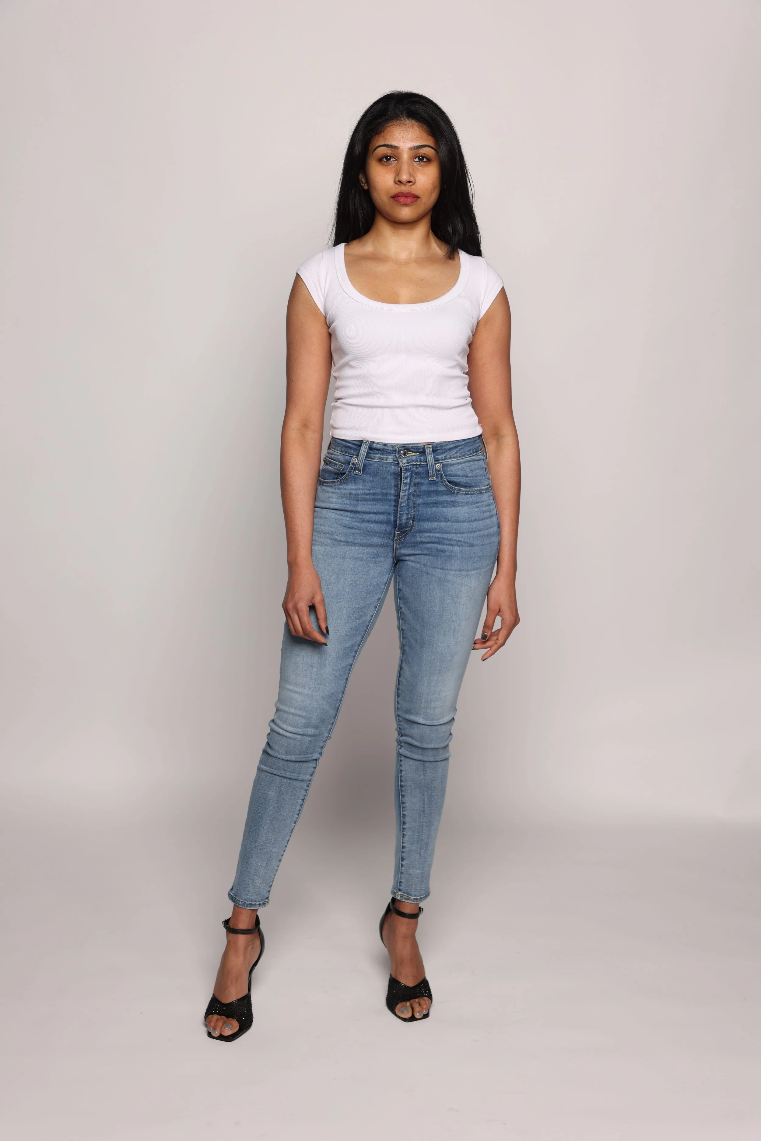 woman white tshirt blue jean smiling1.jpg