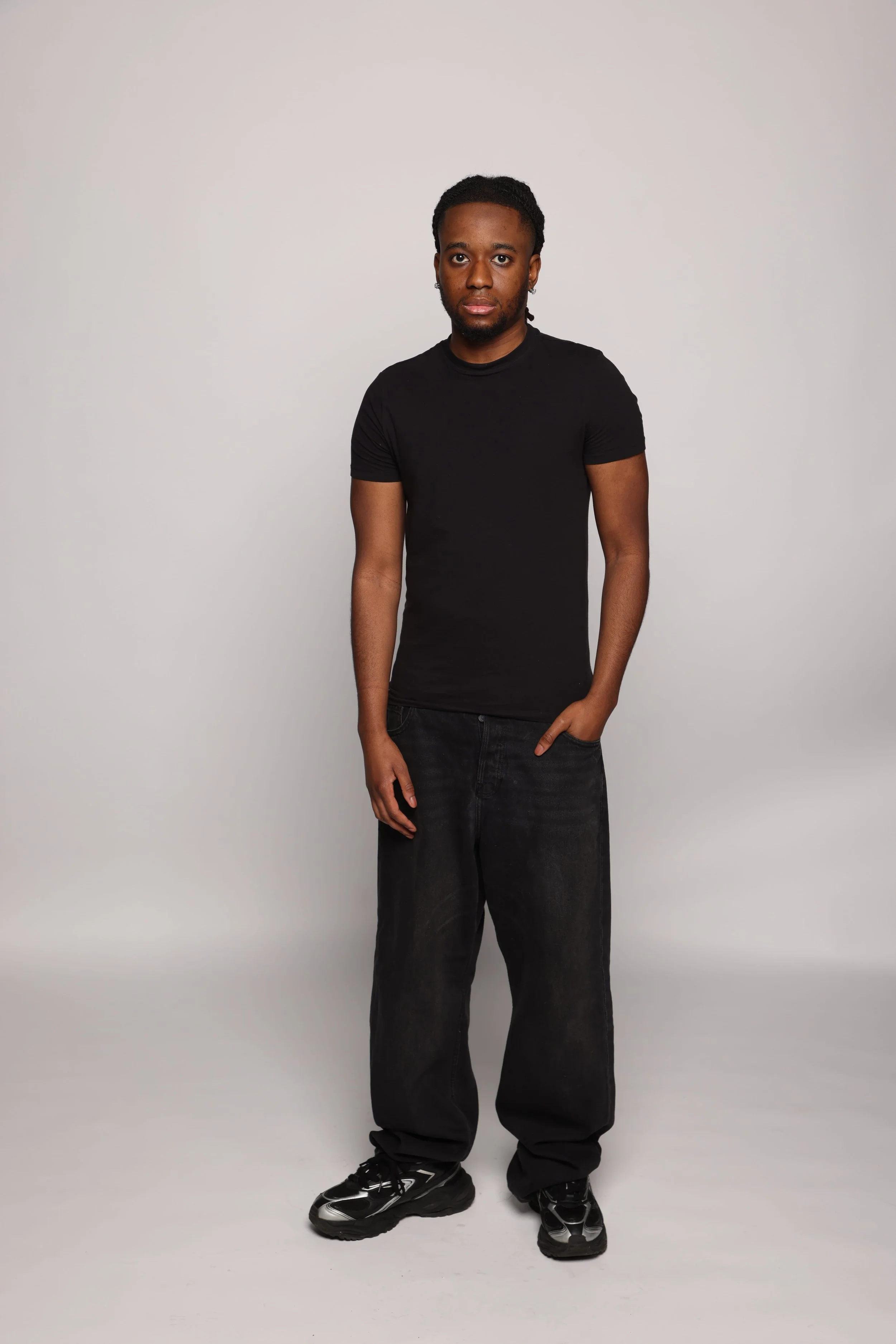 short hair man black tshirt black pants smiling1.jpg