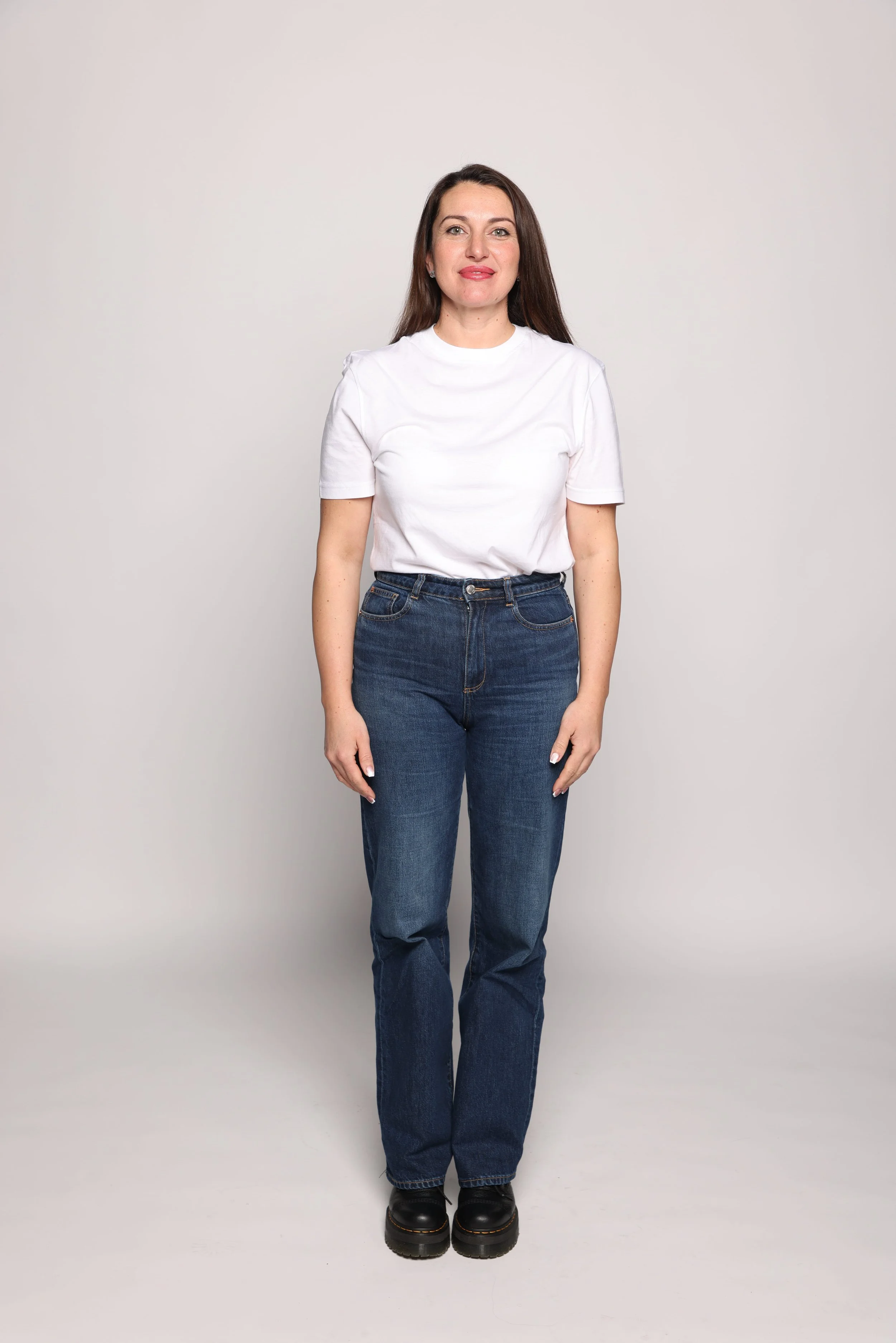 women in white shirt smiling in eko model management studio (1).jpg