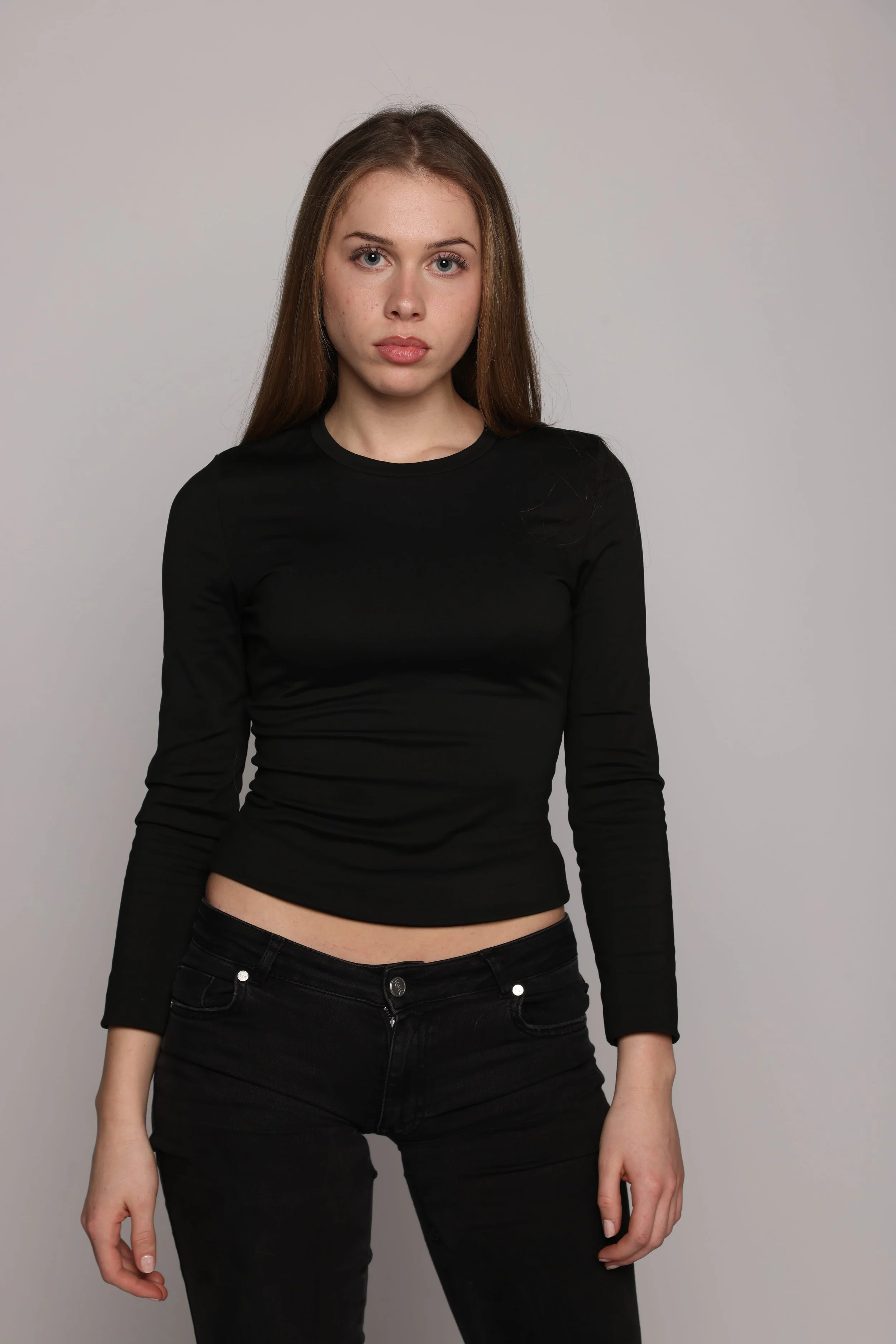 woman black tshirt black jean smiling3.jpg