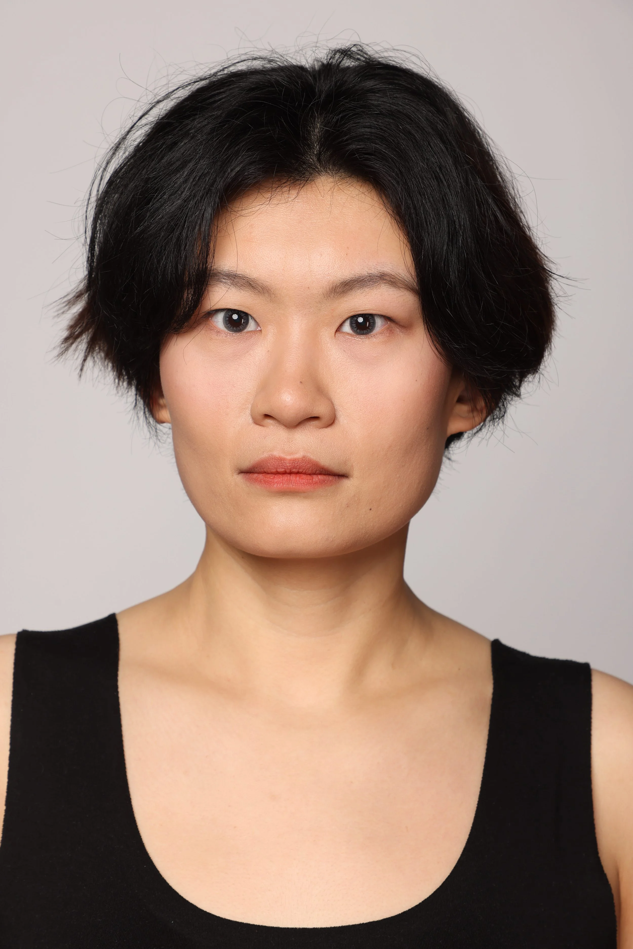 short hair woman black tshirt black pant smiling5.jpg