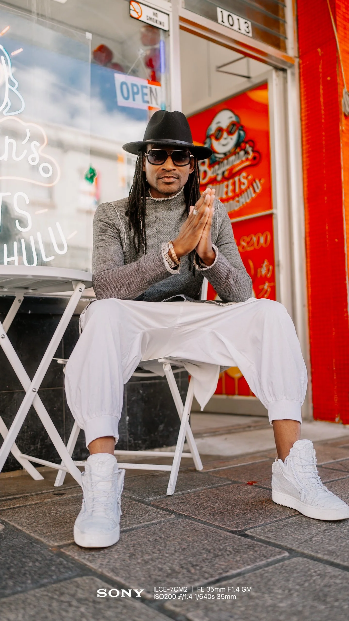  Relaxed Arms (V2)    “Stand tall and let your arms hang naturally by your sides. Laugh away from the camera as if a friend just told you a good joke.”  Men, Sitting, 🌆 City, 35mm 